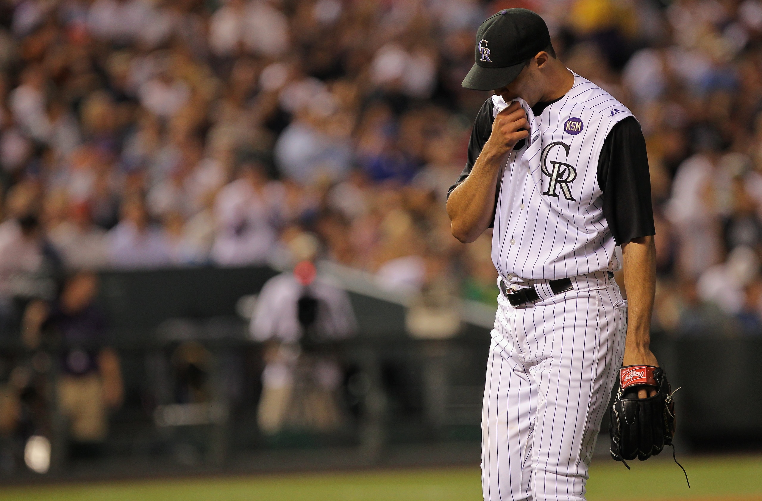 DENVER - SEPTEMBER 27:  Starting pitcher Ubaldo Jimenez #38 of the Colorado Rockies heads for the dugout after the seventh inning against the Los Angeles Dodgers at Coors Field on September 25, 2010 in Denver, Colorado. Jiimenez failed to earn his 20th wi