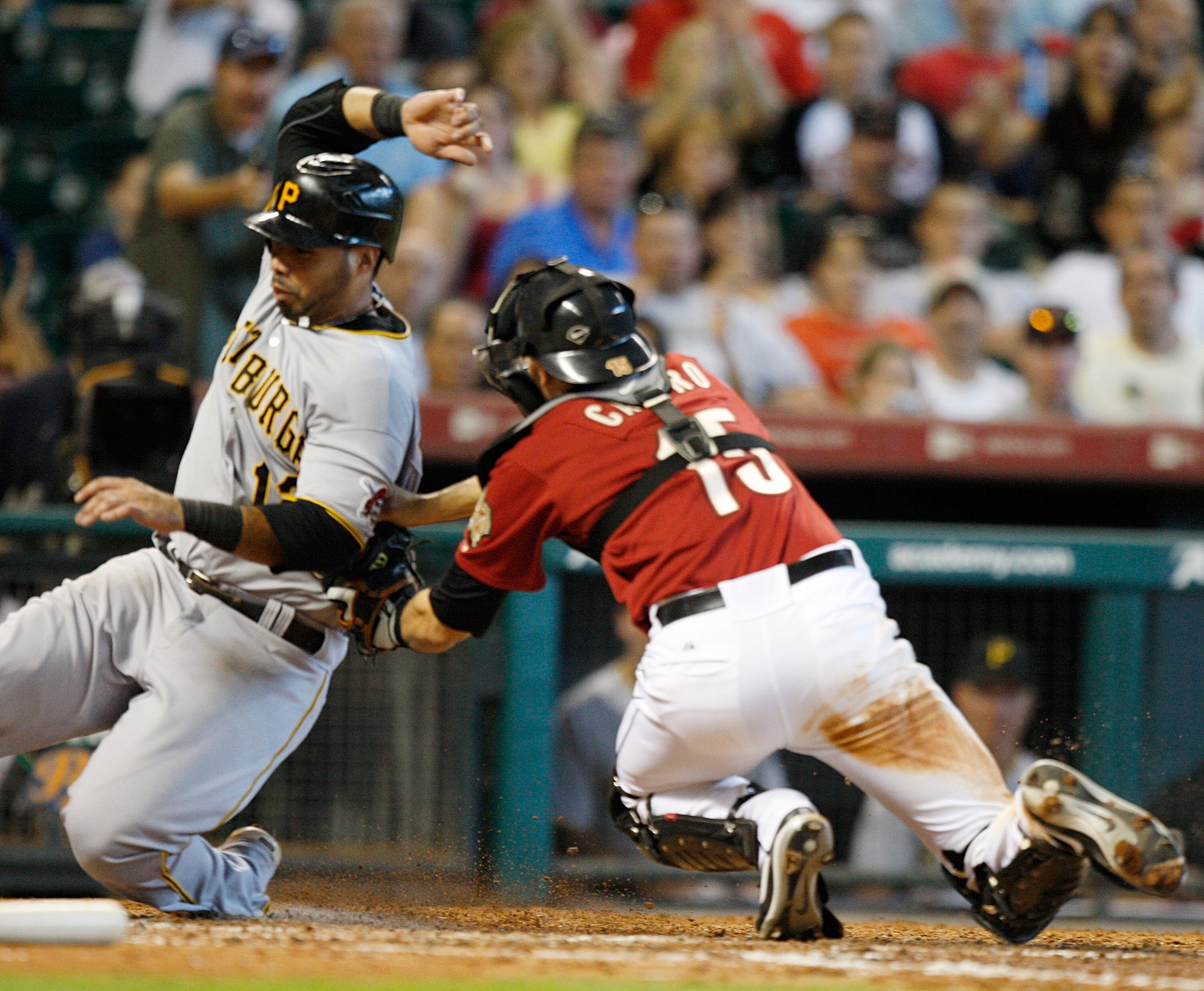 HOUSTON - AUGUST 15:  Pedro Alvarez #17 of the Pittsburgh Pirates is tagged out by catcher Jason Castro #15 of the Houston Astros as he tried to score in the sixth inning at Minute Maid Park on August 15, 2010 in Houston, Texas.  (Photo by Bob Levey/Getty