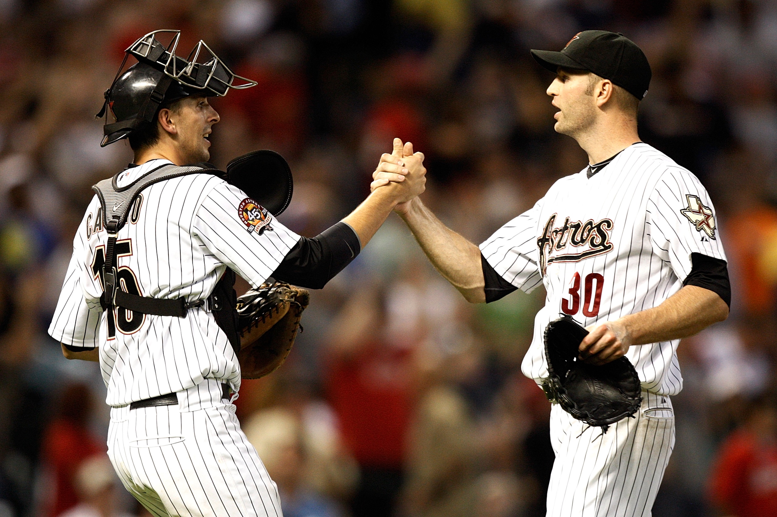 HOUSTON - AUGUST 30:  Catcher Jason Castros #15 and pitcher J.A. Happ #30 of the Houston Astros shake hands after the final out against the St. Louis Cardinals at Minute Maid Park on August 30, 2010 in Houston, Texas. The Astros beat the Cardinals 3-0.  (