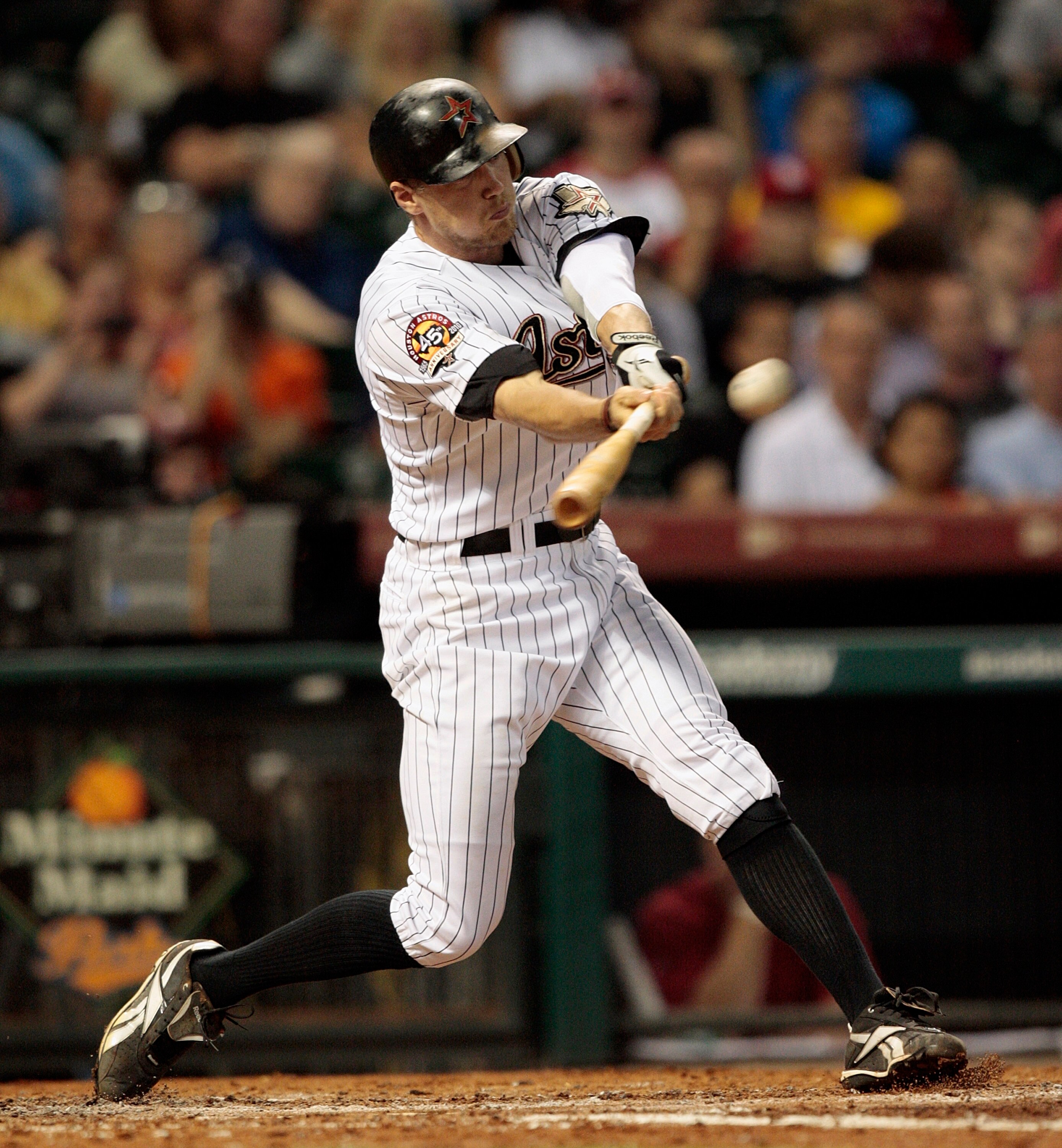 HOUSTON - AUGUST 31:  Hunter Pence #9 of the Houston Astros triples to center field in the fourth inning scoring two runs against the St. Louis Cardinals at Minute Maid Park on August 31, 2010 in Houston, Texas.  (Photo by Bob Levey/Getty Images)