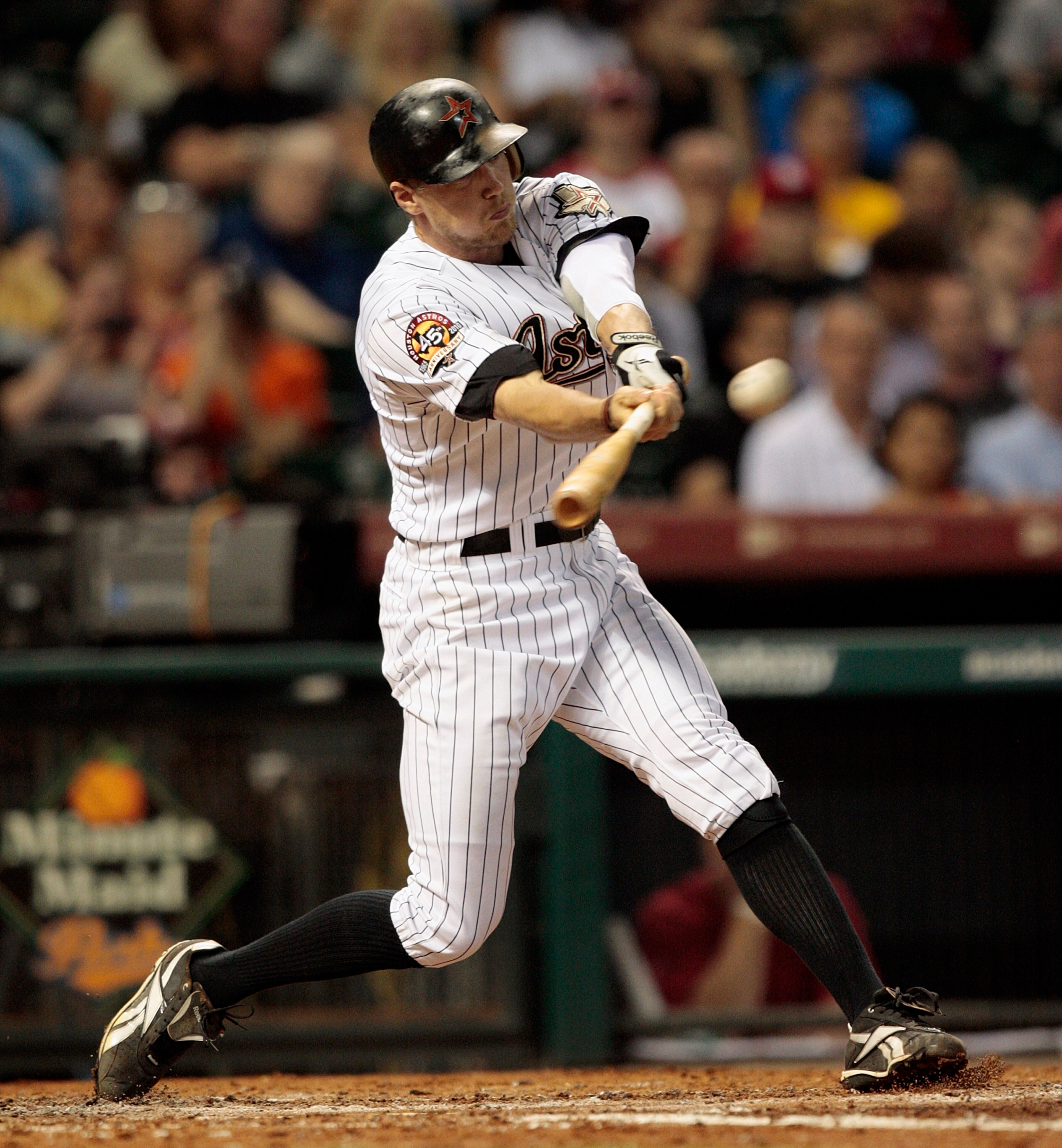 HOUSTON - AUGUST 31:  Hunter Pence #9 of the Houston Astros triples to center field in the fourth inning scoring two runs against the St. Louis Cardinals at Minute Maid Park on August 31, 2010 in Houston, Texas.  (Photo by Bob Levey/Getty Images)