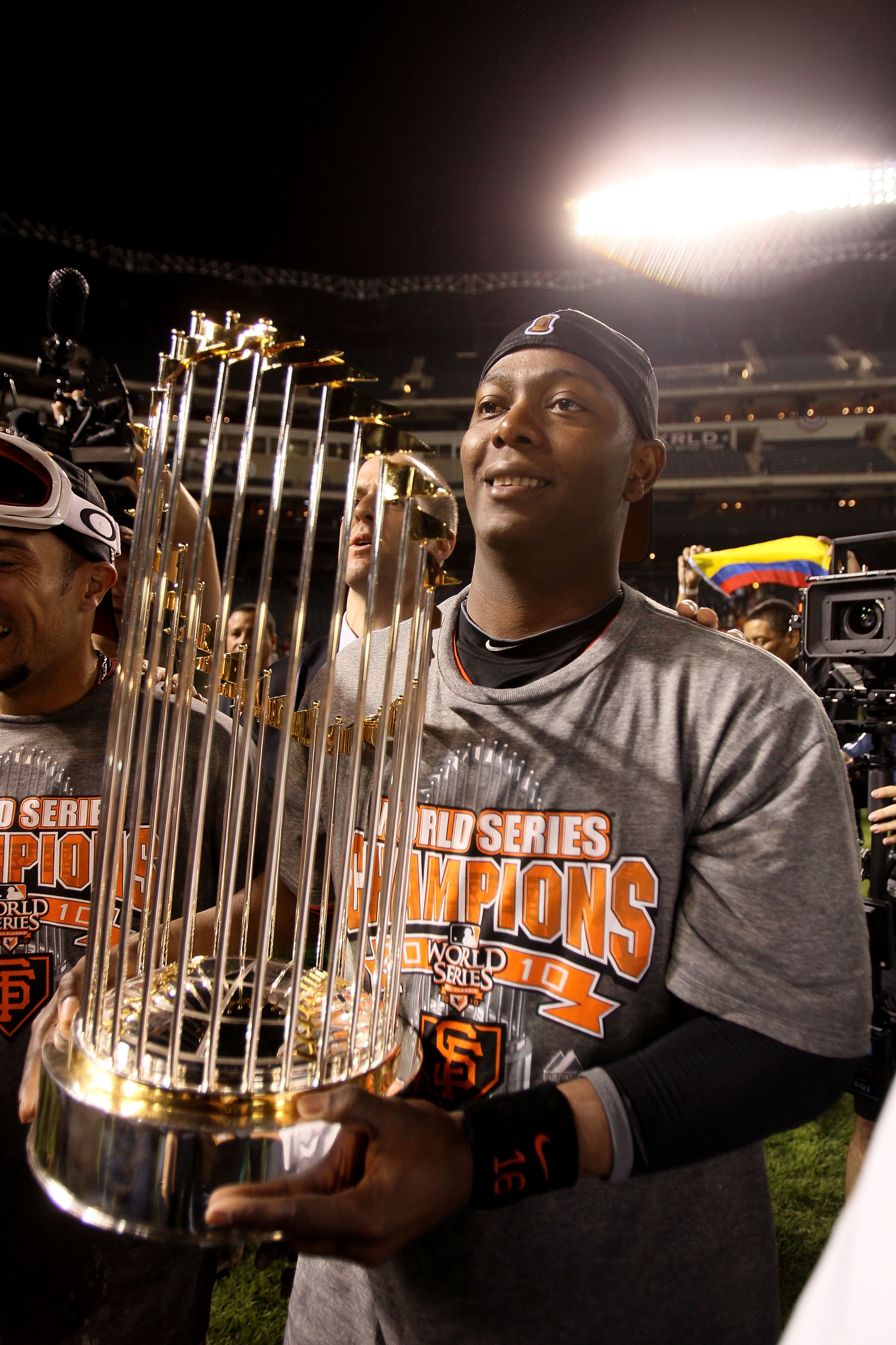 ARLINGTON, TX - NOVEMBER 01:  World Series MVP Edgar Renteria #16 of the San Francisco Giants celebrates on the field with the World Series Championship trophy after the Giants won 3-1 against the Texas Rangers in Game Five of the 2010 MLB World Series at