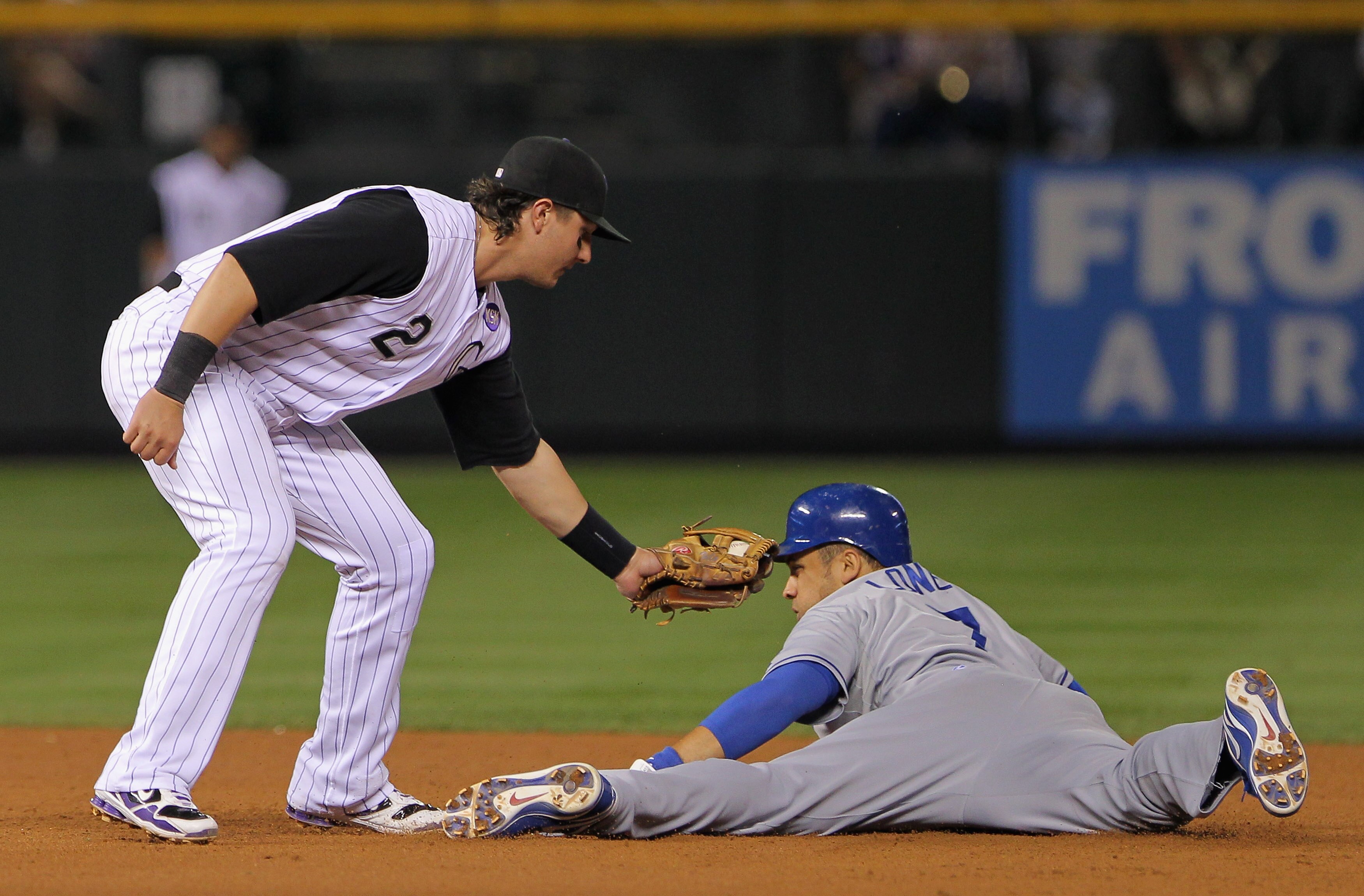 DENVER - SEPTEMBER 27:  James Loney #7 of the Los Angeles Dodgers steals second base as shortstop Troy Tulowitzki #2 of the Colorado Rockies takes the late throw at Coors Field on September 25, 2010 in Denver, Colorado.  (Photo by Doug Pensinger/Getty Ima