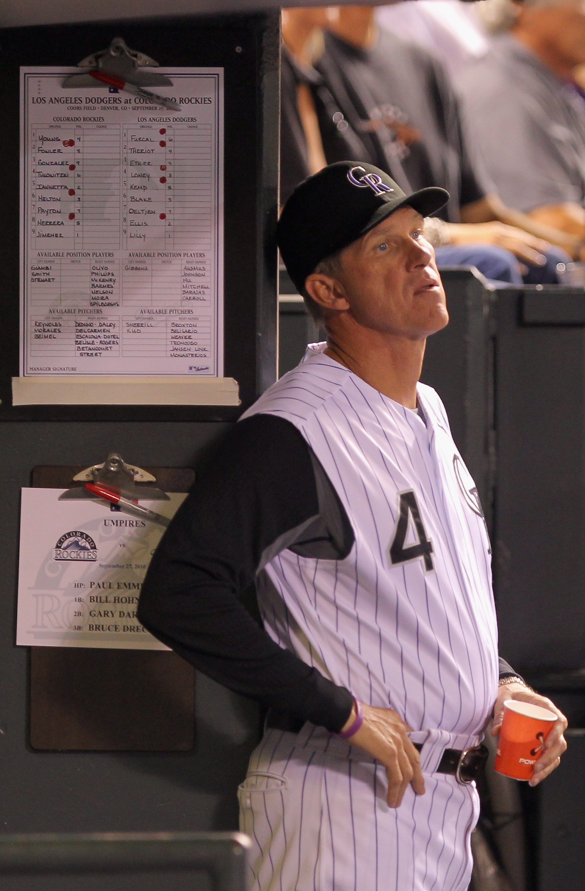 DENVER - SEPTEMBER 27:  Manager Jim Tracy #4 of the Colorado Rockies looks on from the dugout as they face the Los Angeles Dodgers at Coors Field on September 25, 2010 in Denver, Colorado. Jiimenez failed to earn his 20th win of the season.  (Photo by Dou