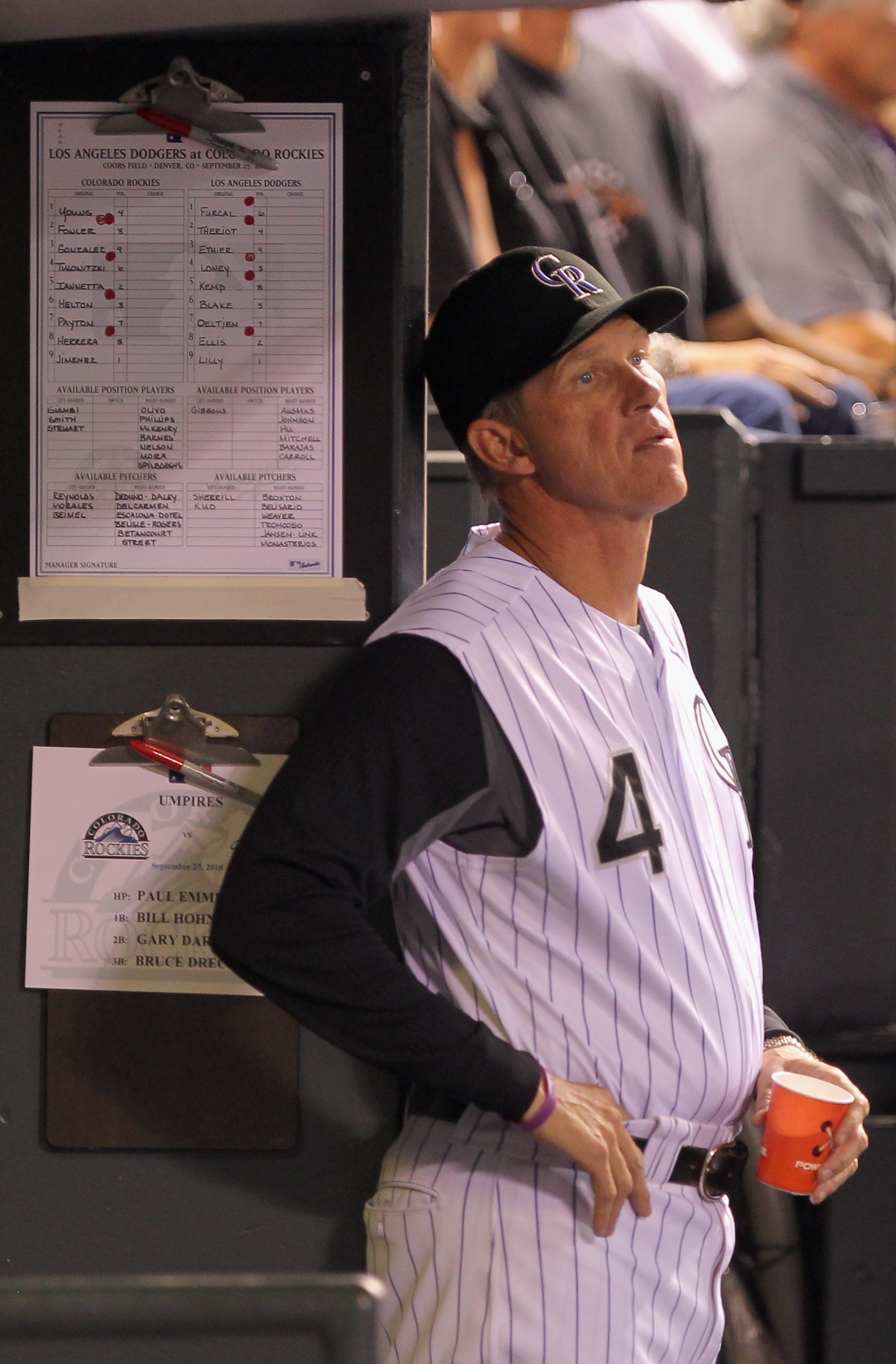 DENVER - SEPTEMBER 27:  Manager Jim Tracy #4 of the Colorado Rockies looks on from the dugout as they face the Los Angeles Dodgers at Coors Field on September 25, 2010 in Denver, Colorado. Jiimenez failed to earn his 20th win of the season.  (Photo by Dou