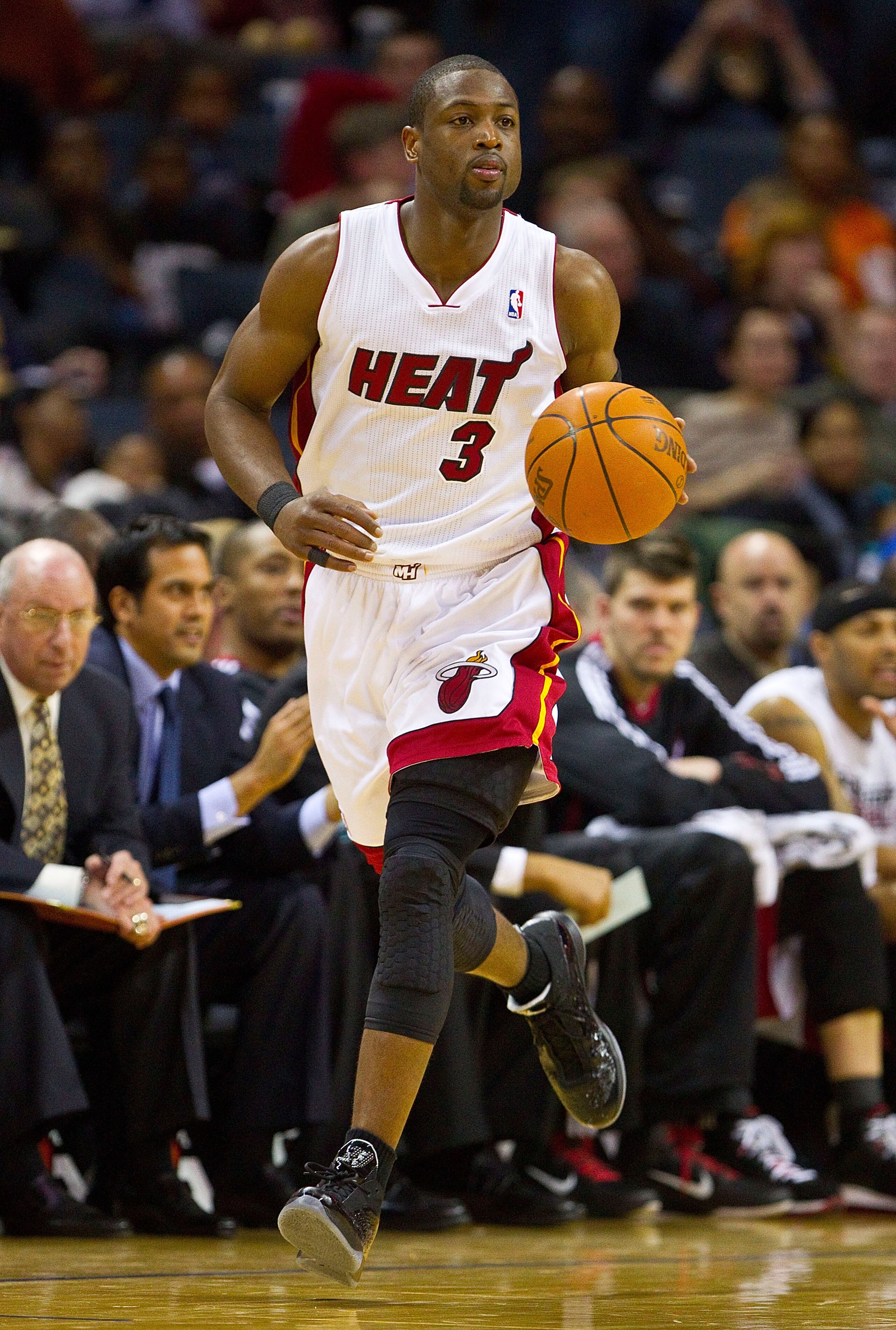 CHARLOTTE, NC - FEBRUARY 04:   Dwyane Wade #3 of the Miami Heat dribbles the ball up court against the Charlotte Bobcats at the Time Warner Cable Arena on February 4, 2011 in Charlotte, North Carolina.  The Heat defeated the Bobcats 109-97.  NOTE TO USER: