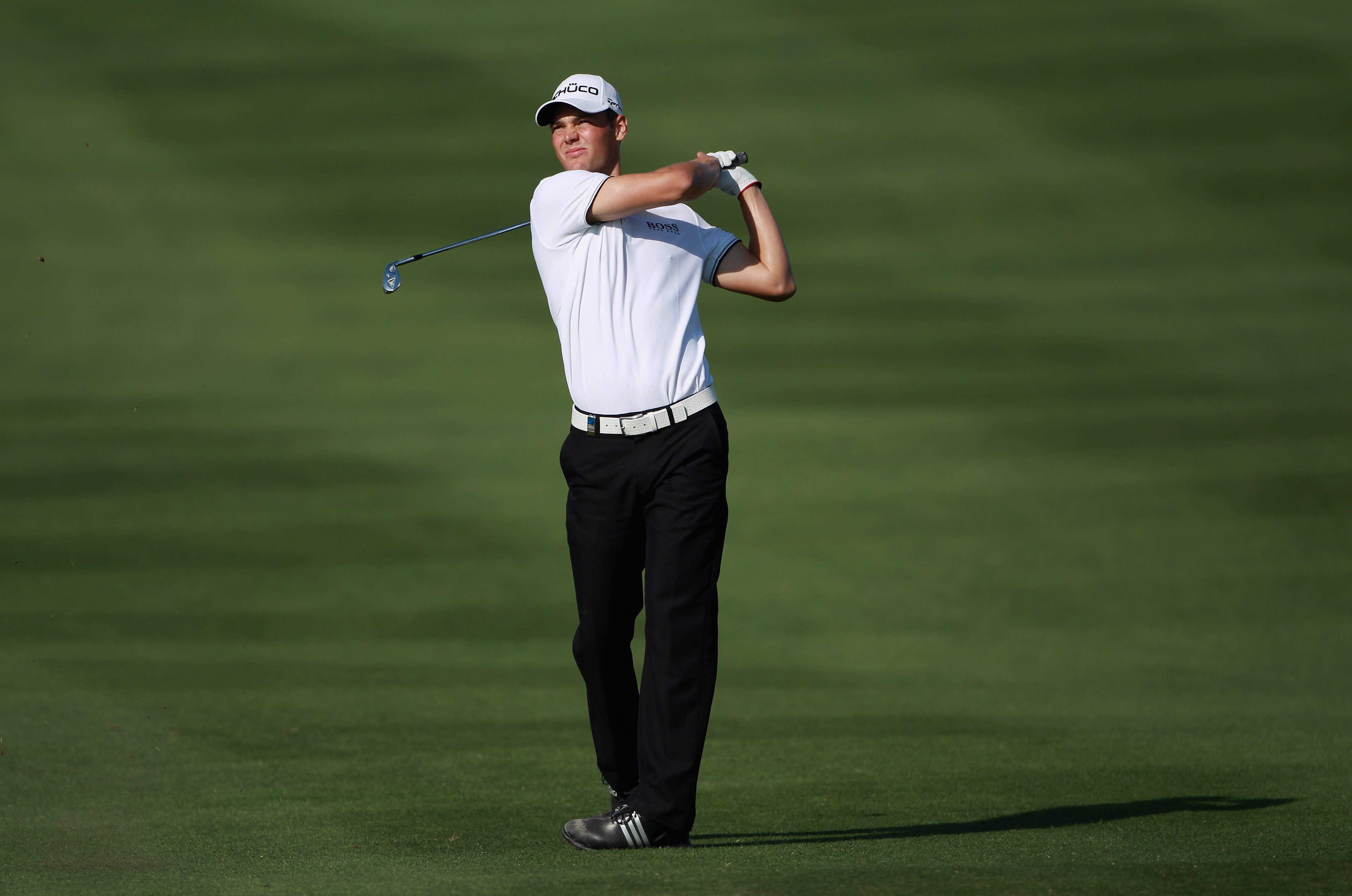 DOHA, QATAR - FEBRUARY 04:  Martin Kaymer of Germany hits his second shot on the 14th hole during the second round of the Commercialbank Qatar Masters held at Doha Golf Club on February 4, 2011 in Doha, Qatar.  (Photo by Andrew Redington/Getty Images)