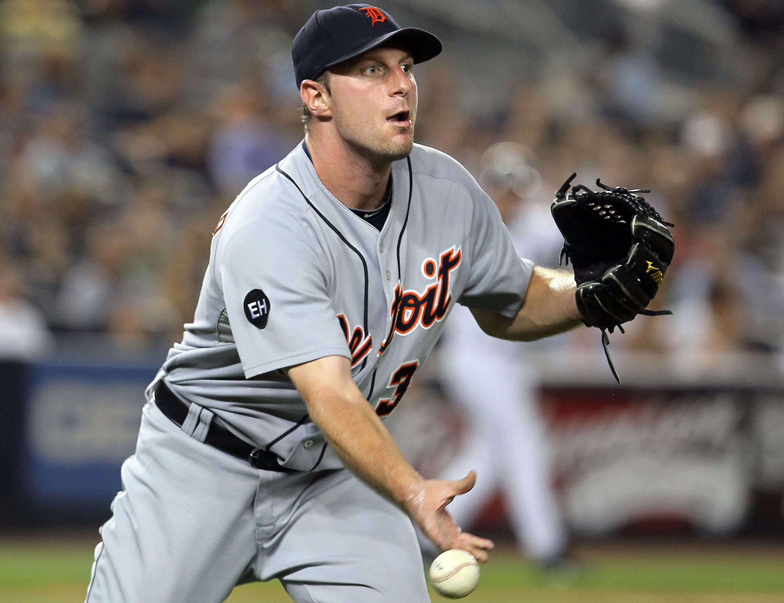 NEW YORK - AUGUST 16:  Max Scherzer #37 of the Detroit Tigers flips the ball to first base for an out against the New York Yankees on August 16, 2010 at Yankee Stadium in the Bronx borough of New York City.  (Photo by Jim McIsaac/Getty Images)