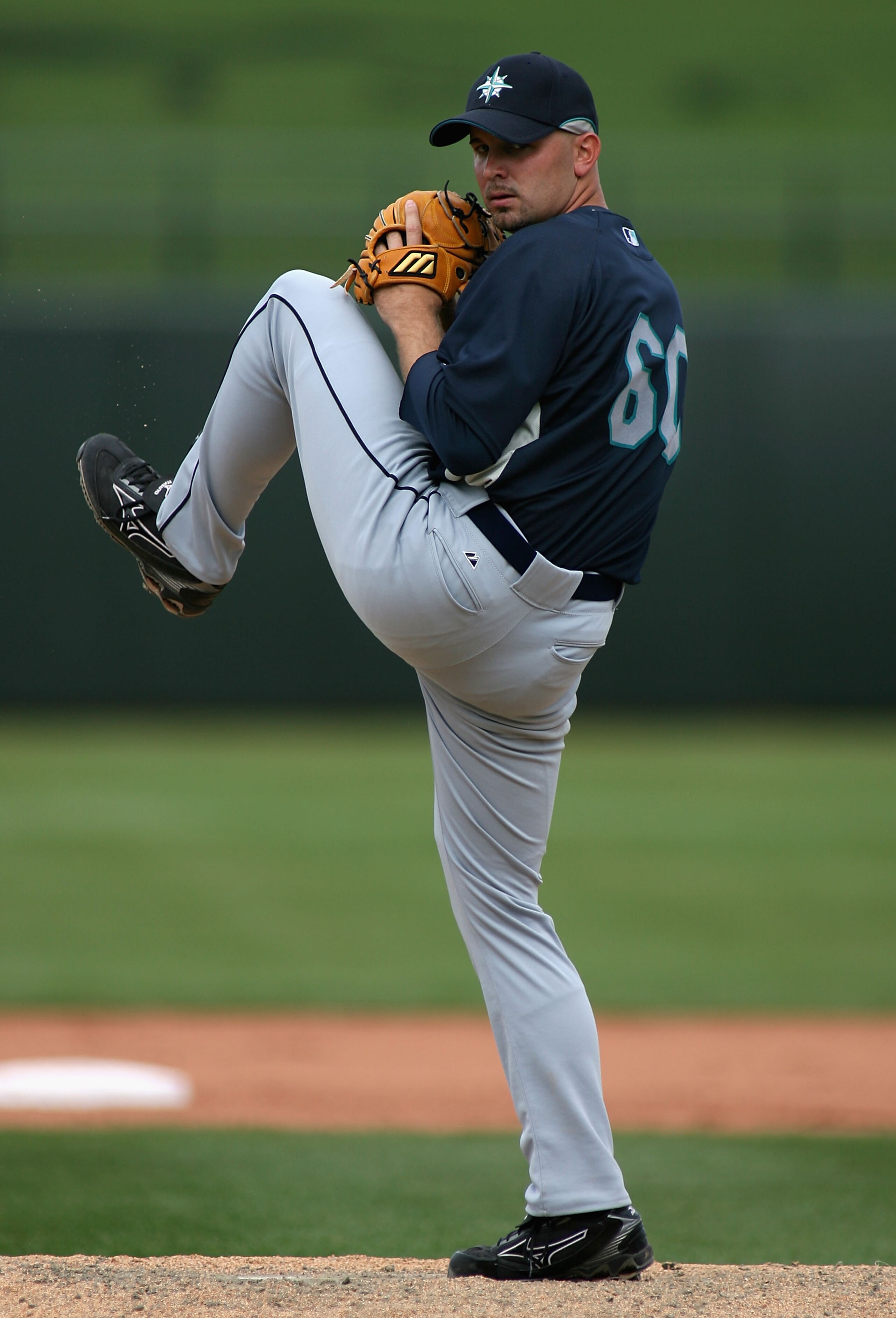 SURPRISE, AZ - MARCH 06: Relief pitcher Jon Huber #60 of the Seattle Mariners pitches against the Texas Rangers during the MLB spring training game at Surprise Stadium on March 6, 2007 in Surprise, Arizona. The Mariners defeated the Rangers 10-3. (Pho SURPRISE, AZ - MARCH 06: Relief pitcher Jon Huber #60 of the Seattle Mariners pitches against the Texas Rangers during the MLB spring training game at Surprise Stadium on March 6, 2007 in Surprise, Arizona. The Mariners defeated the Rangers 10-3. (Pho
