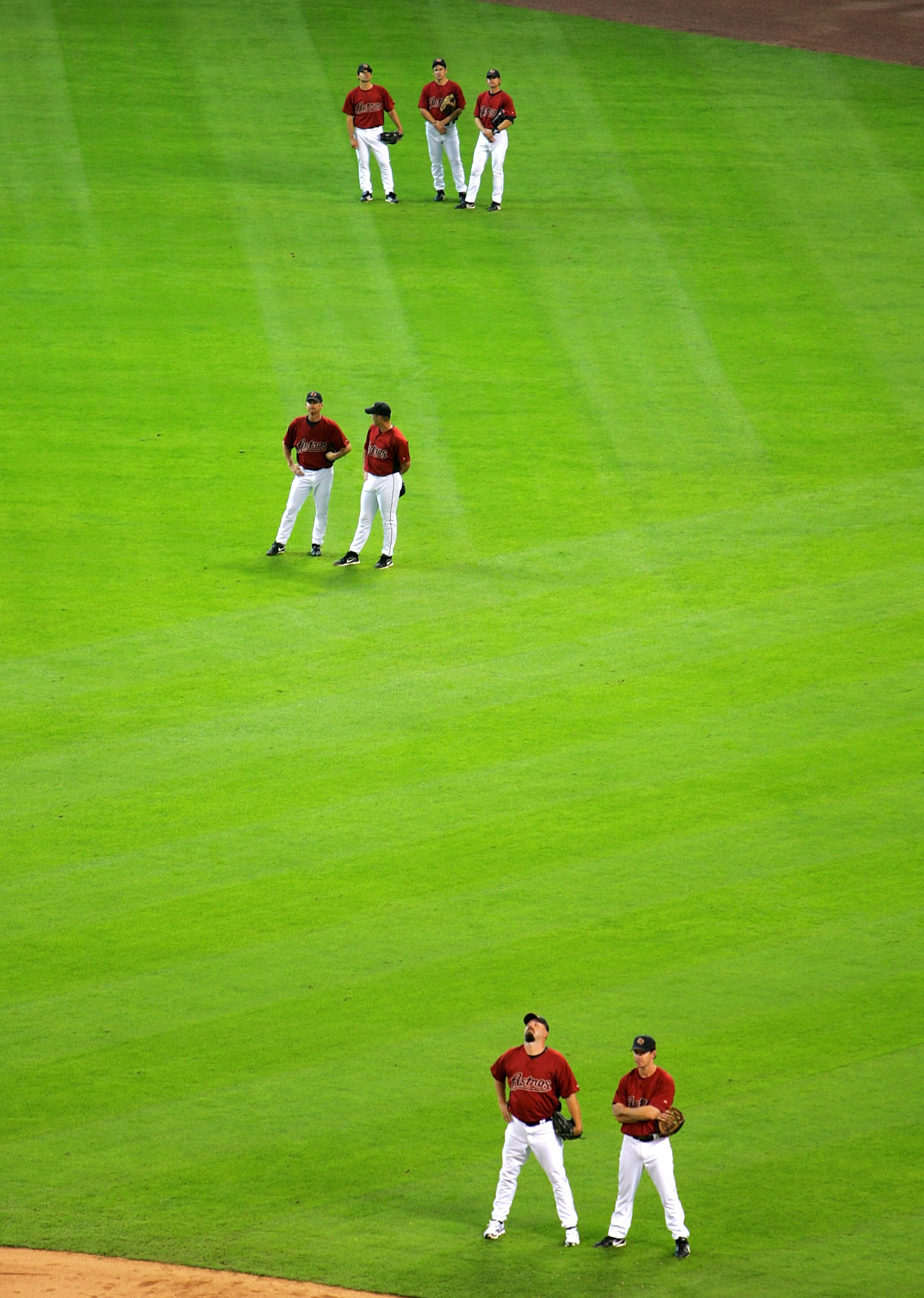 HOUSTON - APRIL 2:  Members of the Houston Astros stand in the outfield during batting practice before the game against the Pittsburgh Pirates on April 2, 2007 at Minute Maid Park in Houston, Texas. (Photo by Stephen Dunn/Getty Images)