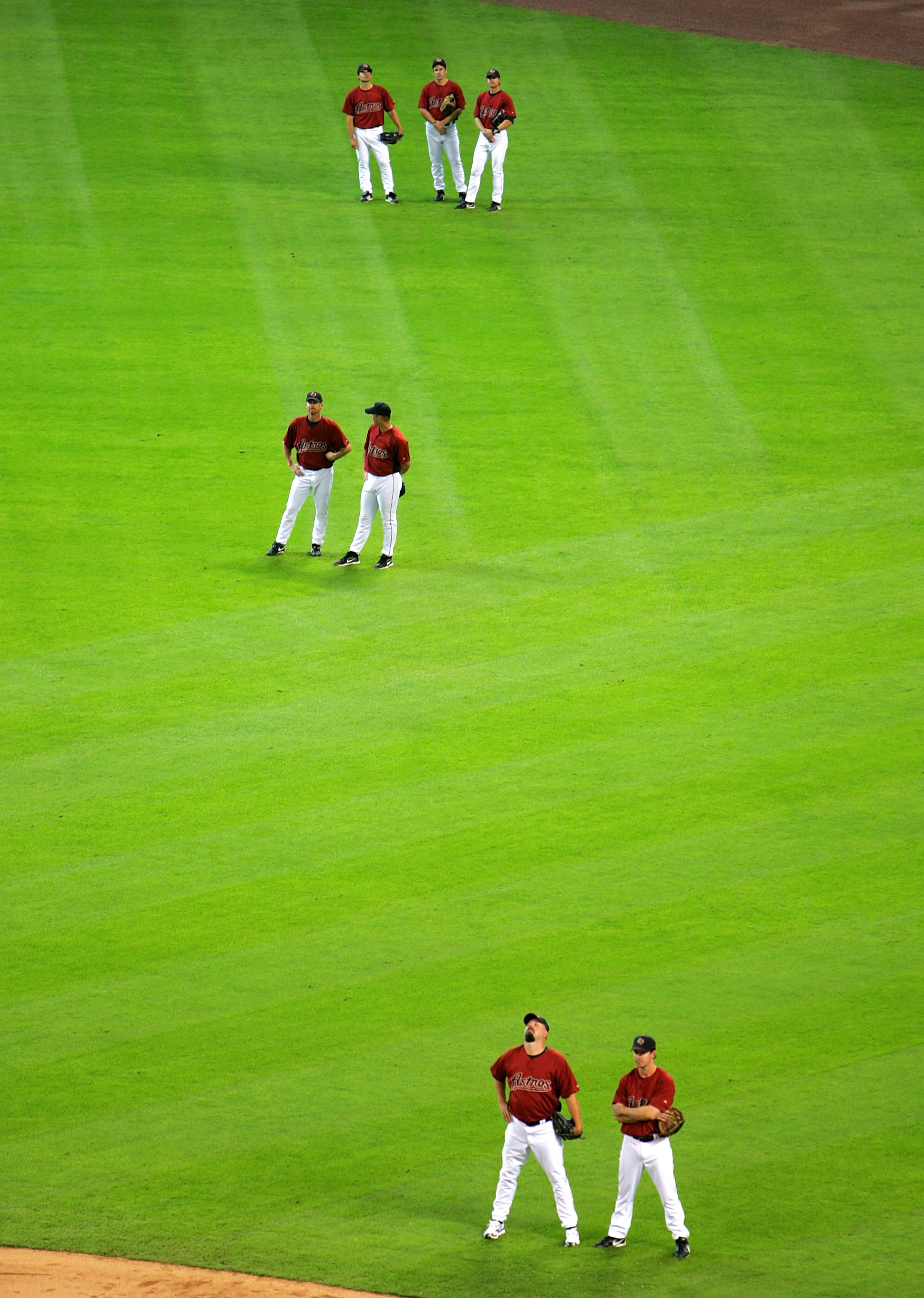 HOUSTON - APRIL 2:  Members of the Houston Astros stand in the outfield during batting practice before the game against the Pittsburgh Pirates on April 2, 2007 at Minute Maid Park in Houston, Texas. (Photo by Stephen Dunn/Getty Images)