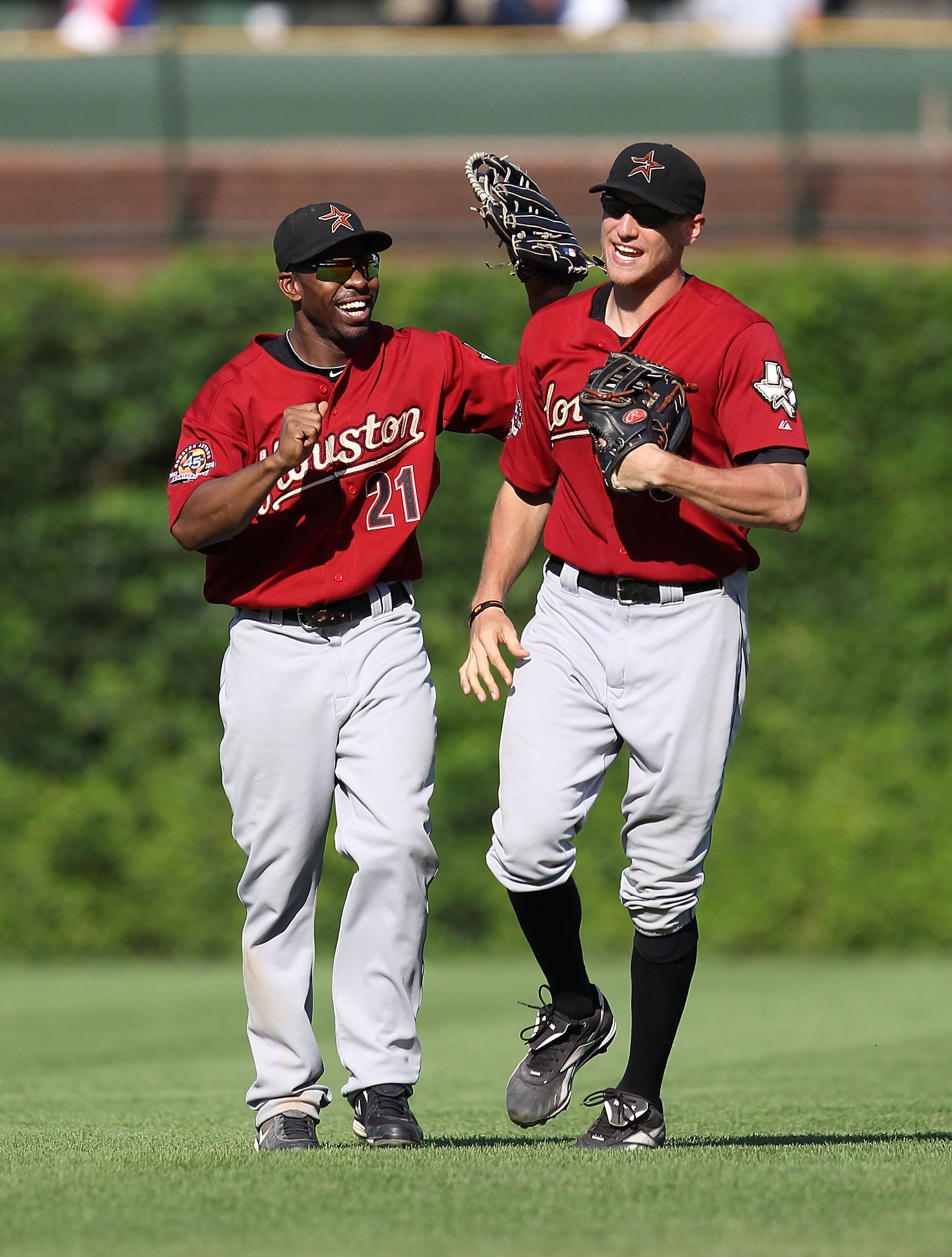 CHICAGO - JULY 21: Michael Bourn #21 and Hunter Pence #9 of the Houston Astros celebrate a win over the Chicago Cubs at Wrigley Field on July 21, 2010 in Chicago, Illinois. The Astros defeated the Cubs 4-3 in 12 innings. (Photo by Jonathan Daniel/Getty Im