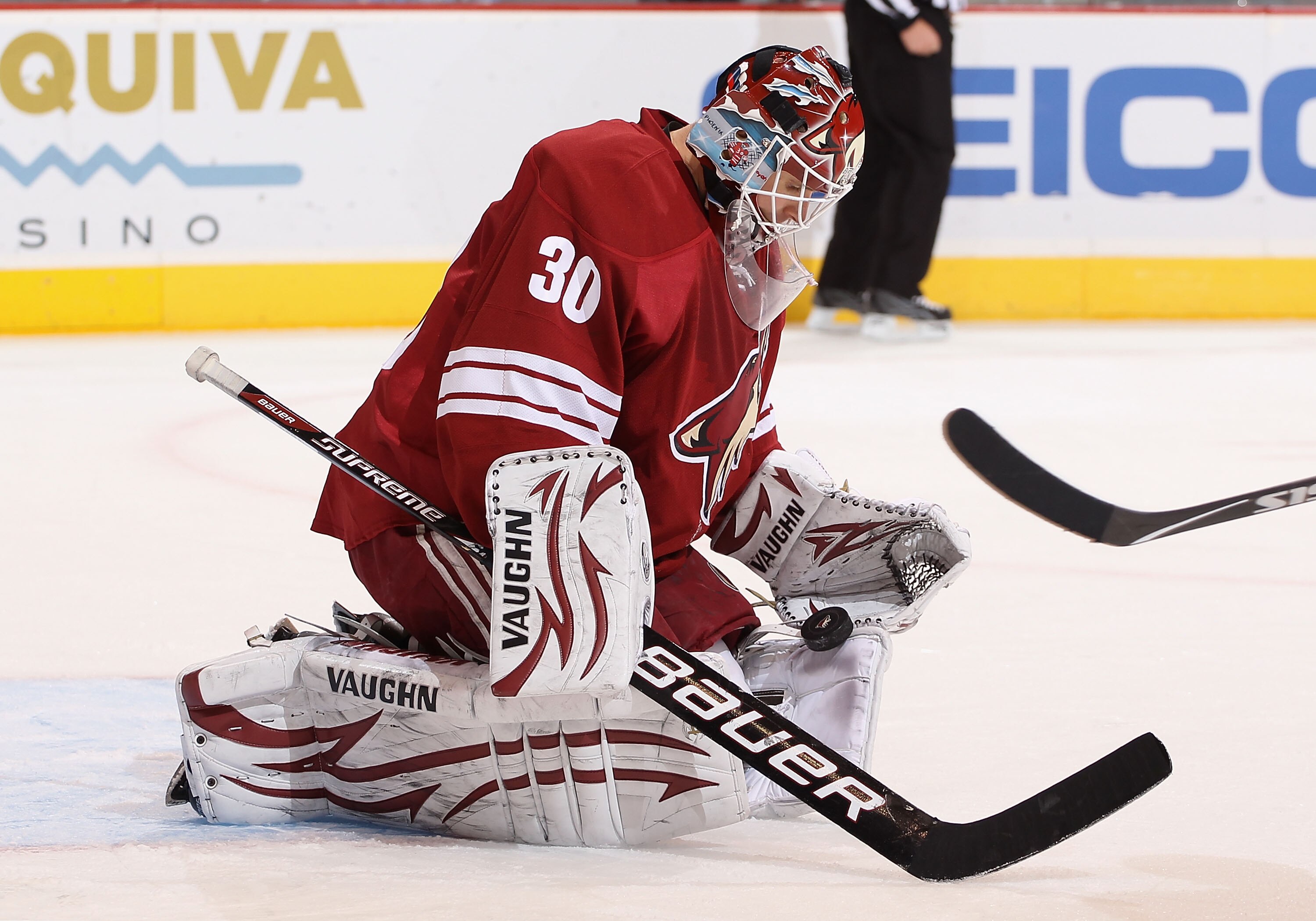 GLENDALE, AZ - FEBRUARY 02:  Goaltender Ilya Bryzgalov #30 of the Phoenix Coyotes makes a save on the shot from the Vancouver Canucks during the NHL game at Jobing.com Arena on February 2, 2011 in Glendale, Arizona.  (Photo by Christian Petersen/Getty Ima