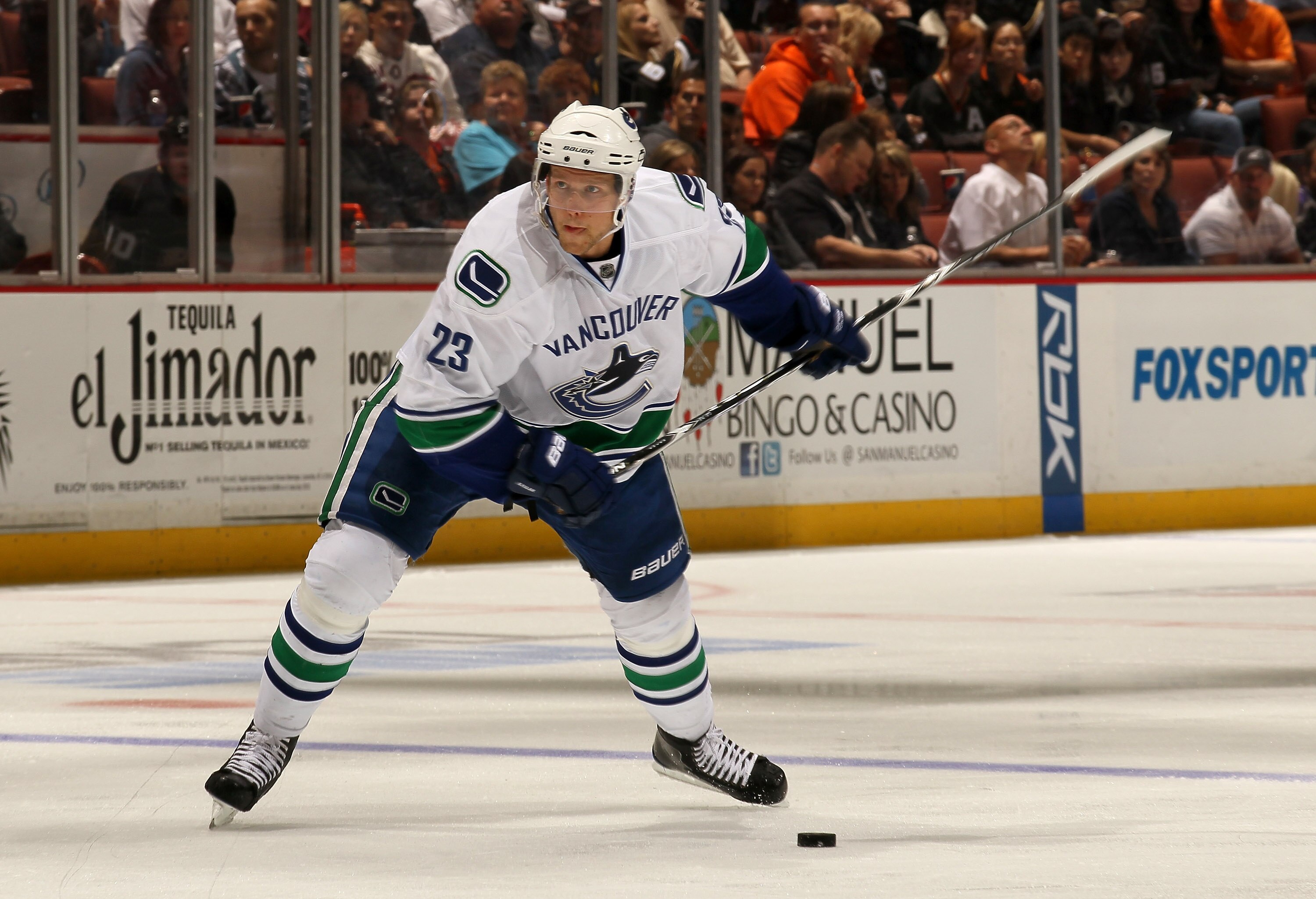 ANAHEIM, CA - OCTOBER 1:  Alex Edler #23 of the Vancouver Canucks fires a slapshot and scores their second goal against the Anaheim Ducks at Honda Center on October 1, 2010 in Anaheim, California.  Vancouver won 4-2.  (Photo by Stephen Dunn/Getty Images)