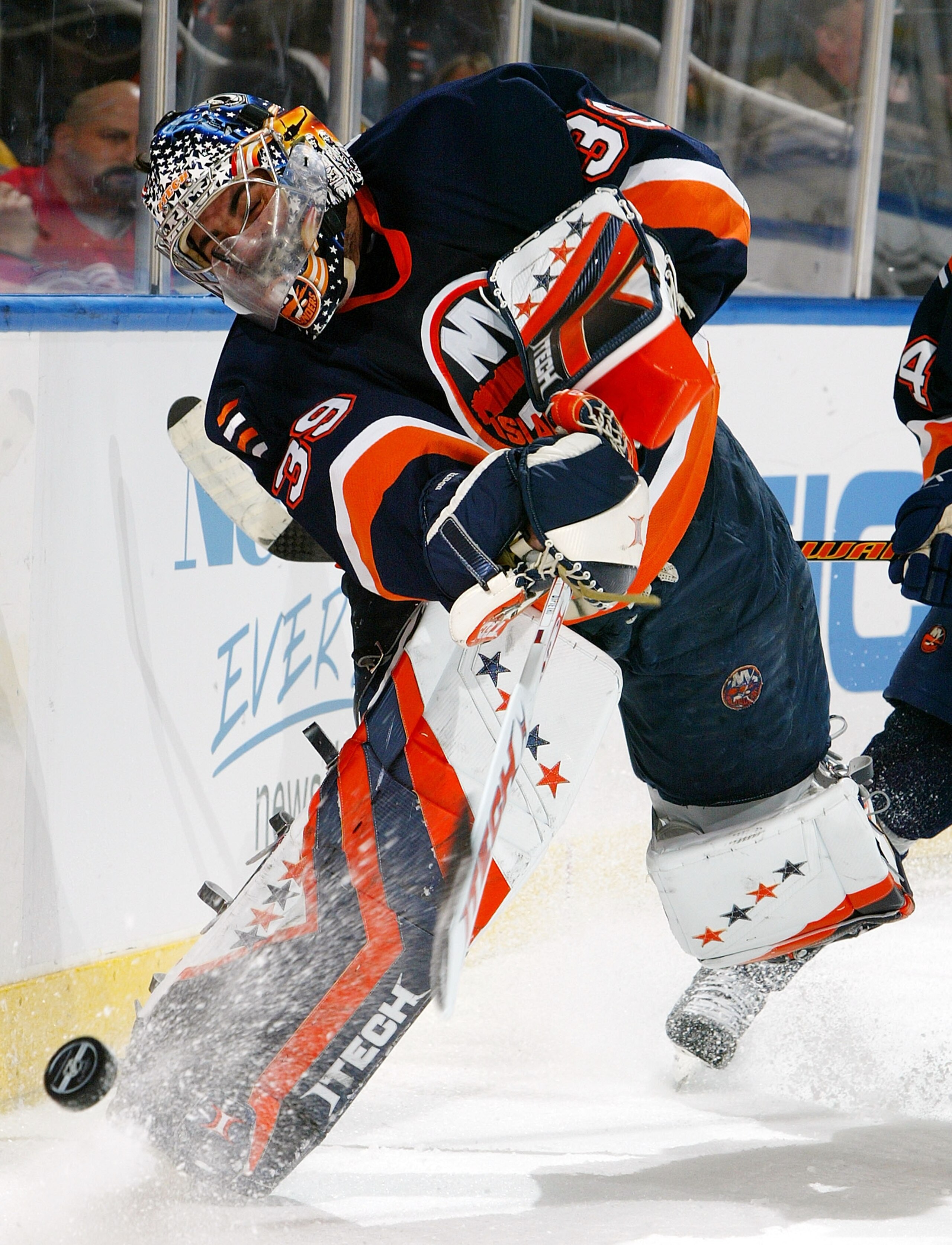 UNIONDALE, NY - JANUARY 30:  Rick DiPetro #39 of the New York Islanders clears the puck against the Detroit Red Wings on January 30, 2007 at Nassau Coliseum in Uniondale, New York.  (Photo by Jim McIsaac/Getty Images)