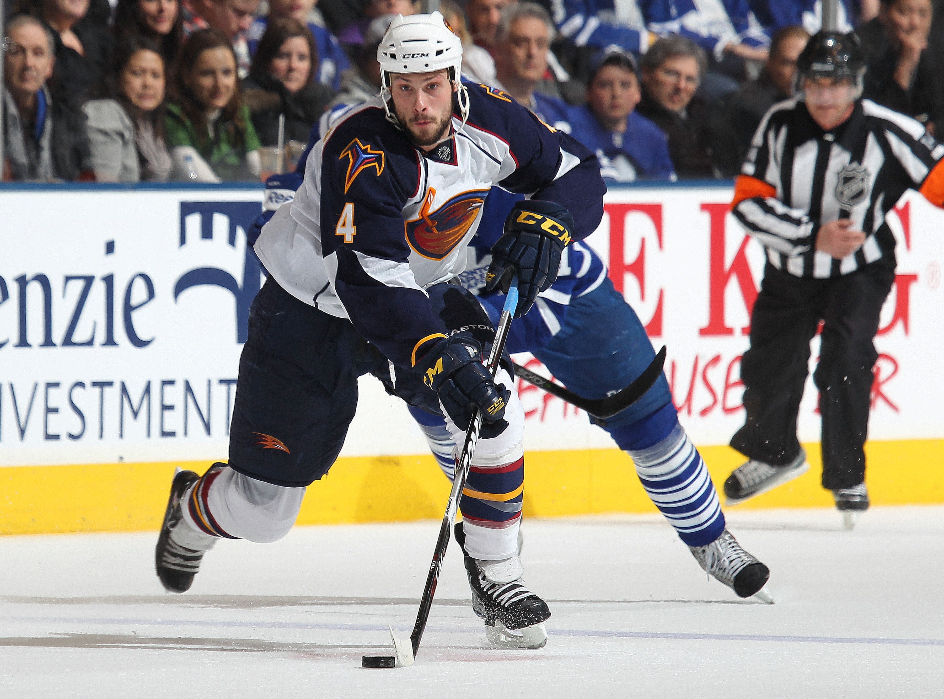 TORONTO, CANADA - FEBRUARY 7:  Zach Bogosian #4 of the Atlanta Thrashers skates up ice with the puck in a game against the Toronto Maple Leafs on February 7, 2011 at the Air Canada Centre in Toronto, Canada. The Leafs defeated the Thrashers 5-4. (Photo by