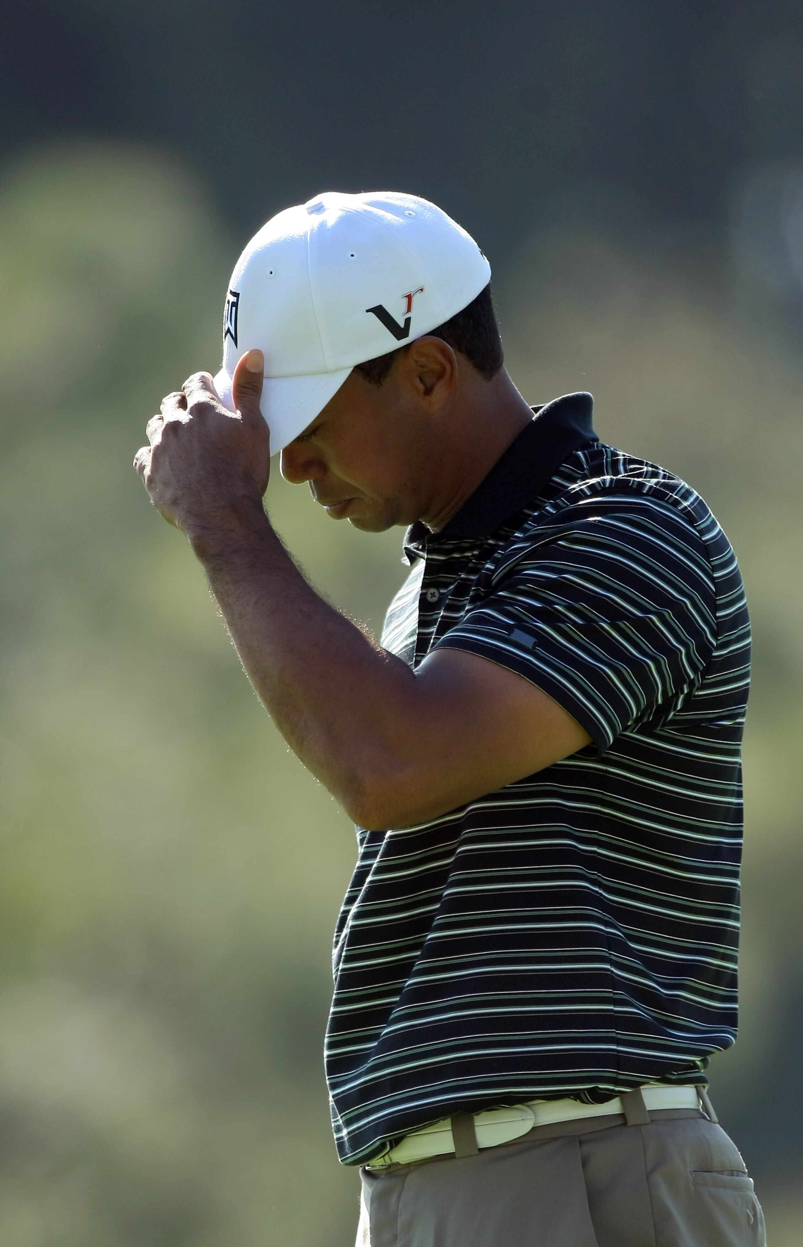LA JOLLA, CA - JANUARY 29:  Tiger Woods reacts to a missed pitt on the 15th hole during Round 3 of the Farmers Insurance Open at Torrey Pines on January 29, 2011 in La Jolla, California. (Photo by Donald Miralle/Getty Images)