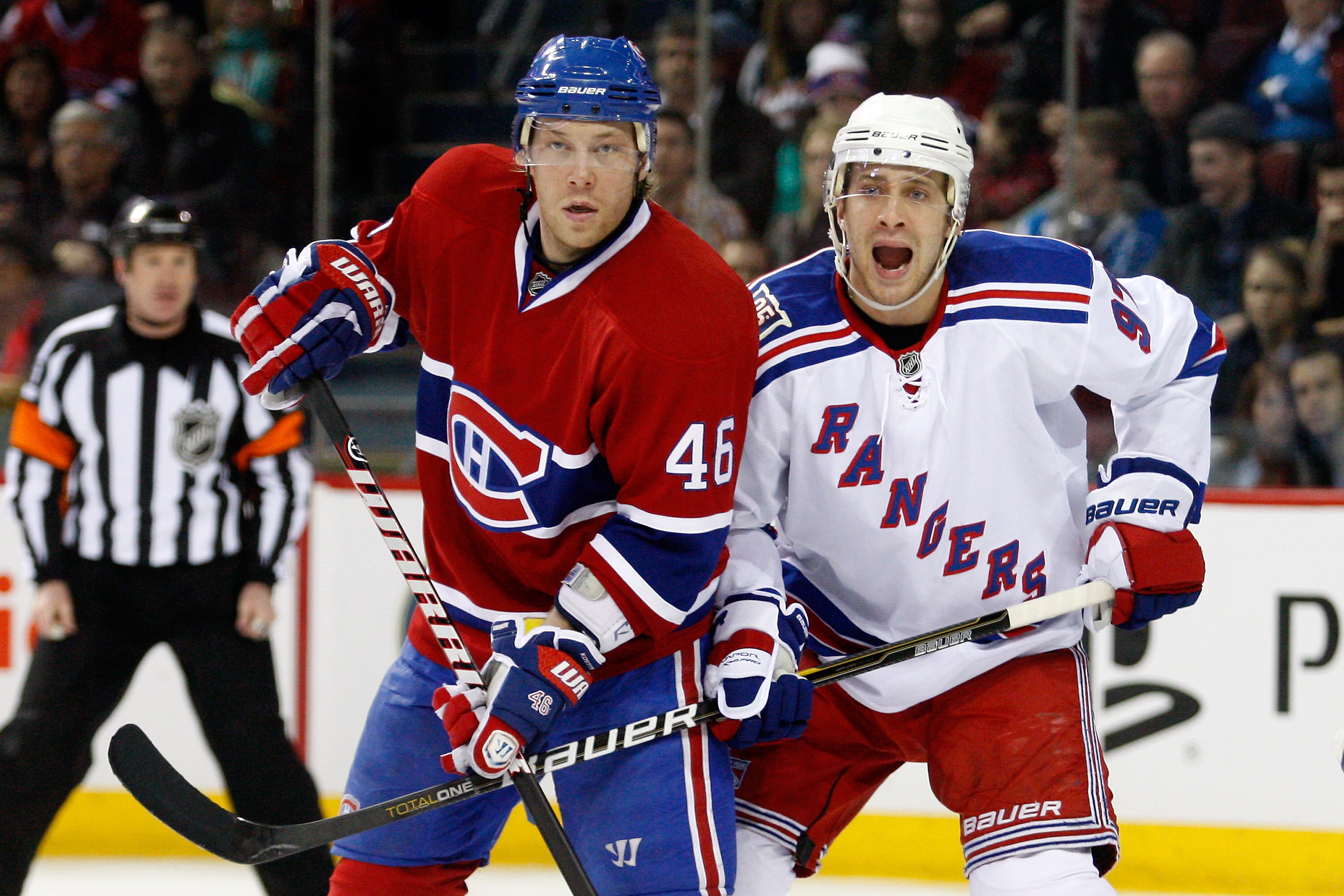 MONTREAL, CANADA - FEBRUARY 5:  Matt Gilroy #97 of the New York Rangers defends against Andrei Kostitsyn #46 of the Montreal Canadiens during the NHL game at the Bell Centre on February 5, 2011 in Montreal, Quebec, Canada.  The Canadiens defeated the Rang