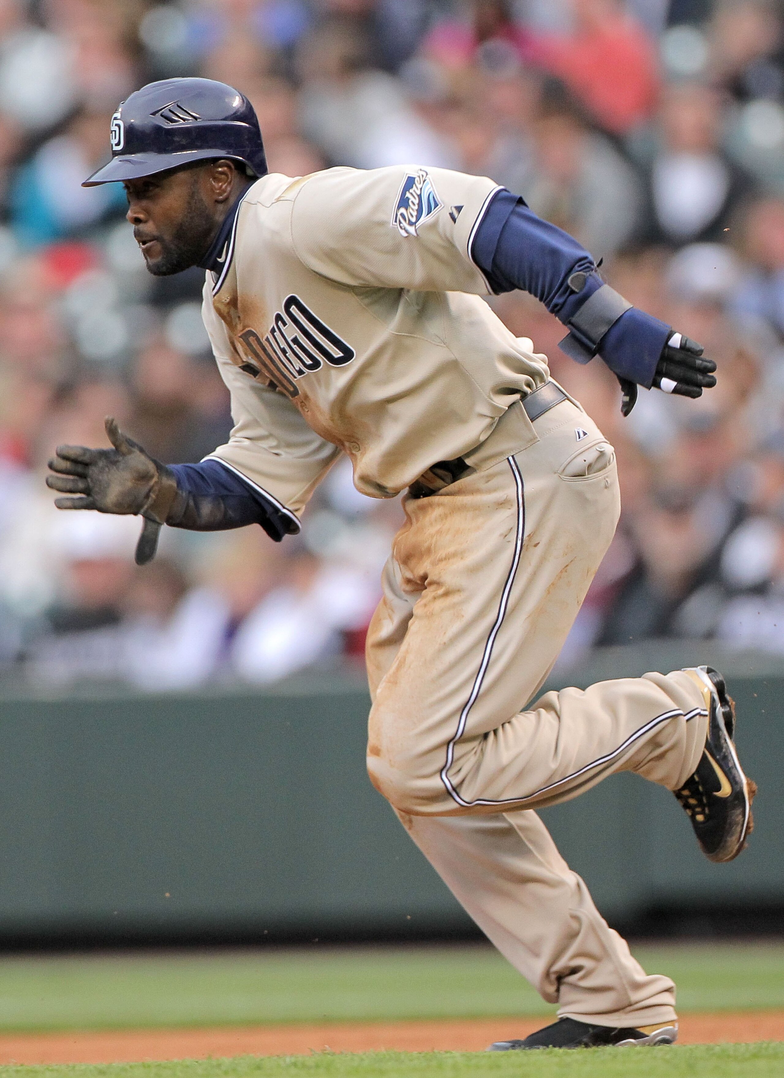 DENVER - APRIL 10: Centerfielder Tony Gwynn Jr. #18 of the San Diego Padres steals secondbase against starting pitcher Jason Hammel of the Colorado Rockies during MLB action at Coors Field on April 10, 2010 in Denver, Colorado. The Padres defeated the Ro DENVER - APRIL 10: Centerfielder Tony Gwynn Jr. #18 of the San Diego Padres steals secondbase against starting pitcher Jason Hammel of the Colorado Rockies during MLB action at Coors Field on April 10, 2010 in Denver, Colorado. The Padres defeated the Ro