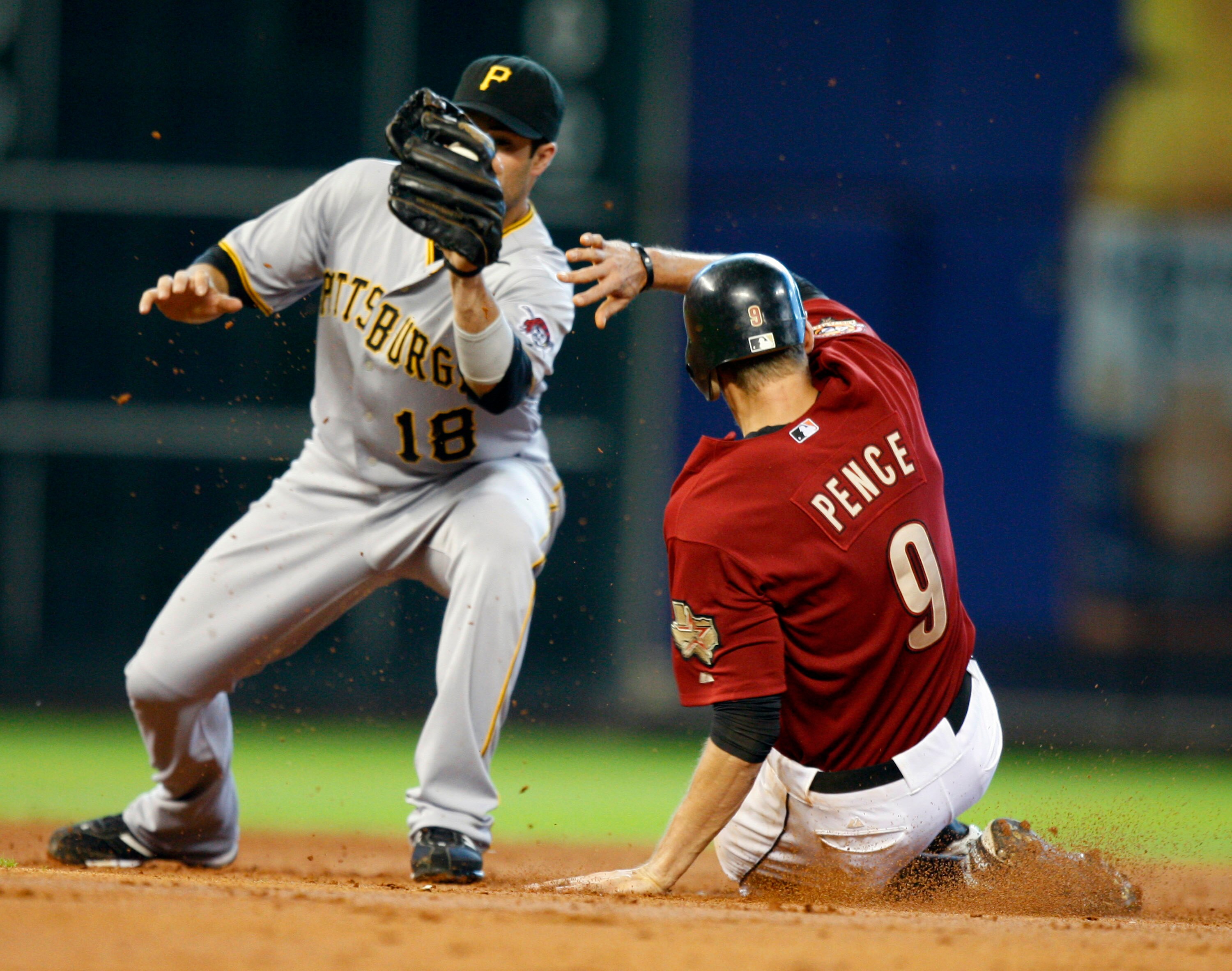 HOUSTON - AUGUST 15:  Hunter Pence #9 of the Houston Astros steals second base in the third inning as second baseman Neil Walker #18 of the Pittsburgh Pirates waits for the throw at Minute Maid Park on August 15, 2010 in Houston, Texas.  (Photo by Bob Lev