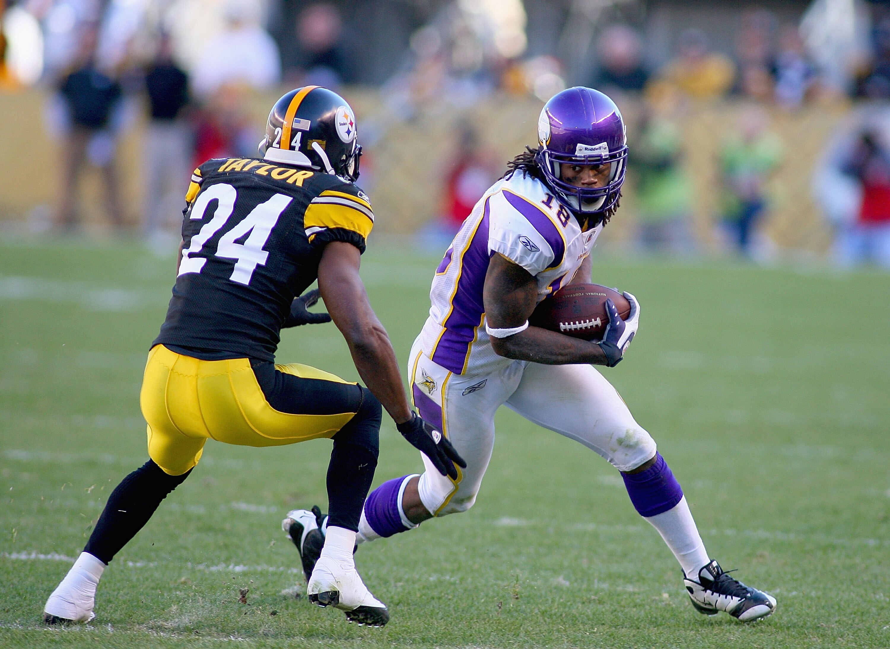 PITTSBURGH - OCTOBER 25: Sidney Rice #18 of the Minnesota Vikings runs after a catch as Ike Taylor #24 of the Pittsburgh Steelers defends at Heinz Field on October 25, 2009 in Pittsburgh, Pennsylvania.  Pittsburgh won 27-17. (Photo by Rick Stewart/Getty I