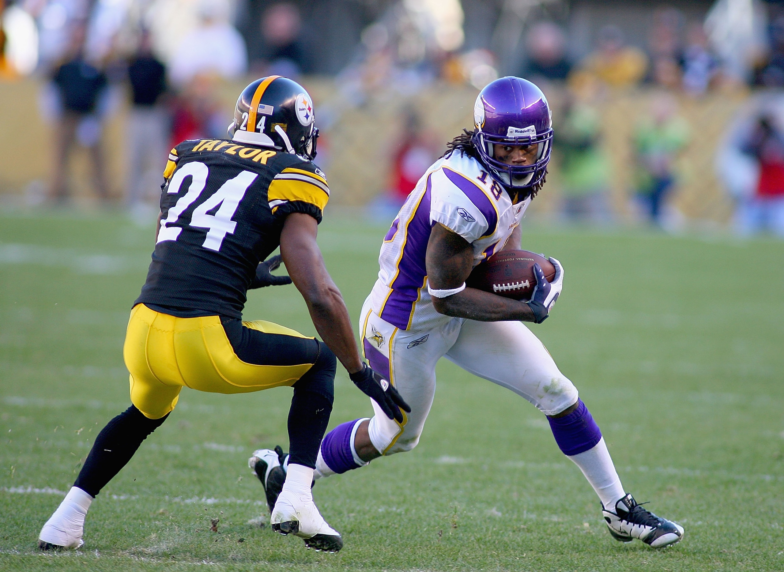 PITTSBURGH - OCTOBER 25: Sidney Rice #18 of the Minnesota Vikings runs after a catch as Ike Taylor #24 of the Pittsburgh Steelers defends at Heinz Field on October 25, 2009 in Pittsburgh, Pennsylvania. Pittsburgh won 27-17. (Photo by Rick Stewart/Getty I PITTSBURGH - OCTOBER 25: Sidney Rice #18 of the Minnesota Vikings runs after a catch as Ike Taylor #24 of the Pittsburgh Steelers defends at Heinz Field on October 25, 2009 in Pittsburgh, Pennsylvania. Pittsburgh won 27-17. (Photo by Rick Stewart/Getty I