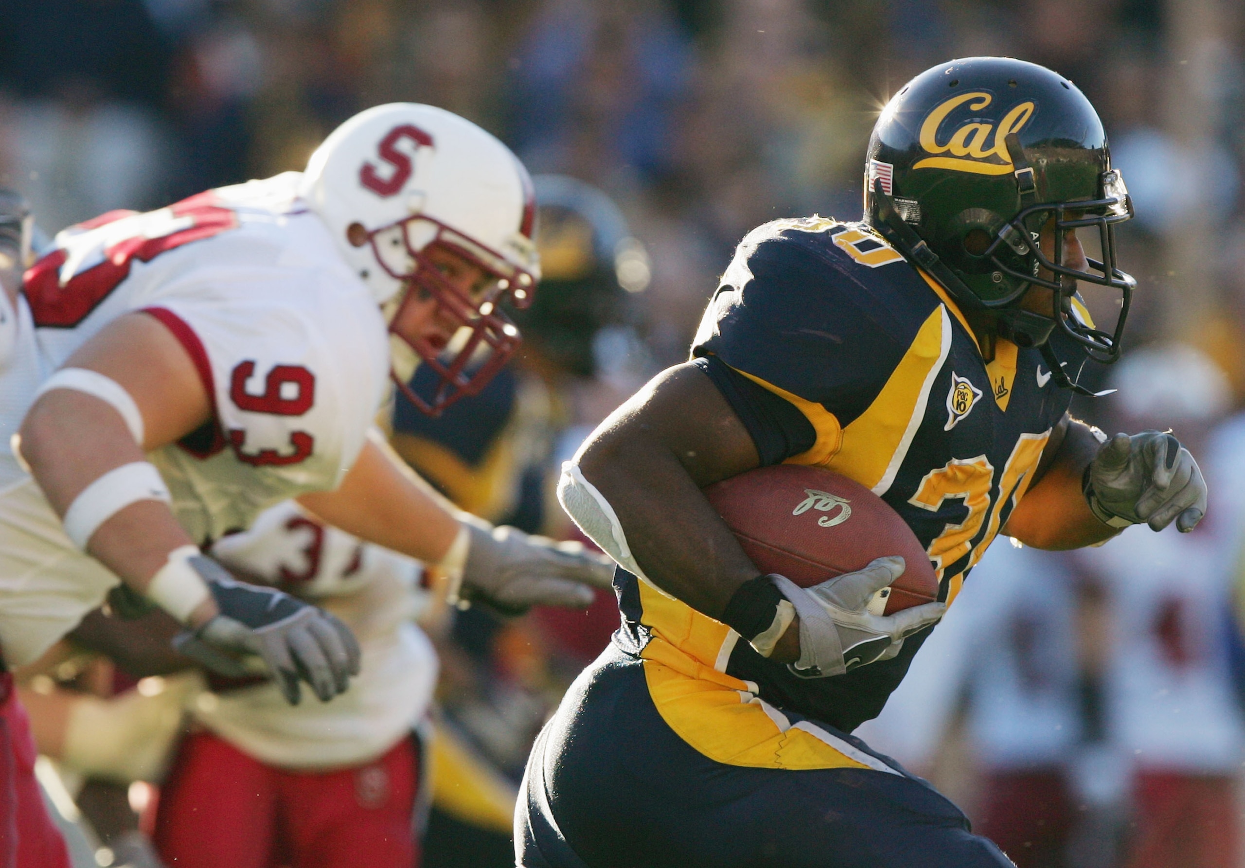 BERKELEY, CA - NOVEMBER 20:  Tailback J.J. Arrington #30 of the University of California, Berkeley Golden Bears carries the ball against the Stanford University Cardinal during the game at Memorial Stadium on November 20, 2004 in Berkeley, California.  Th