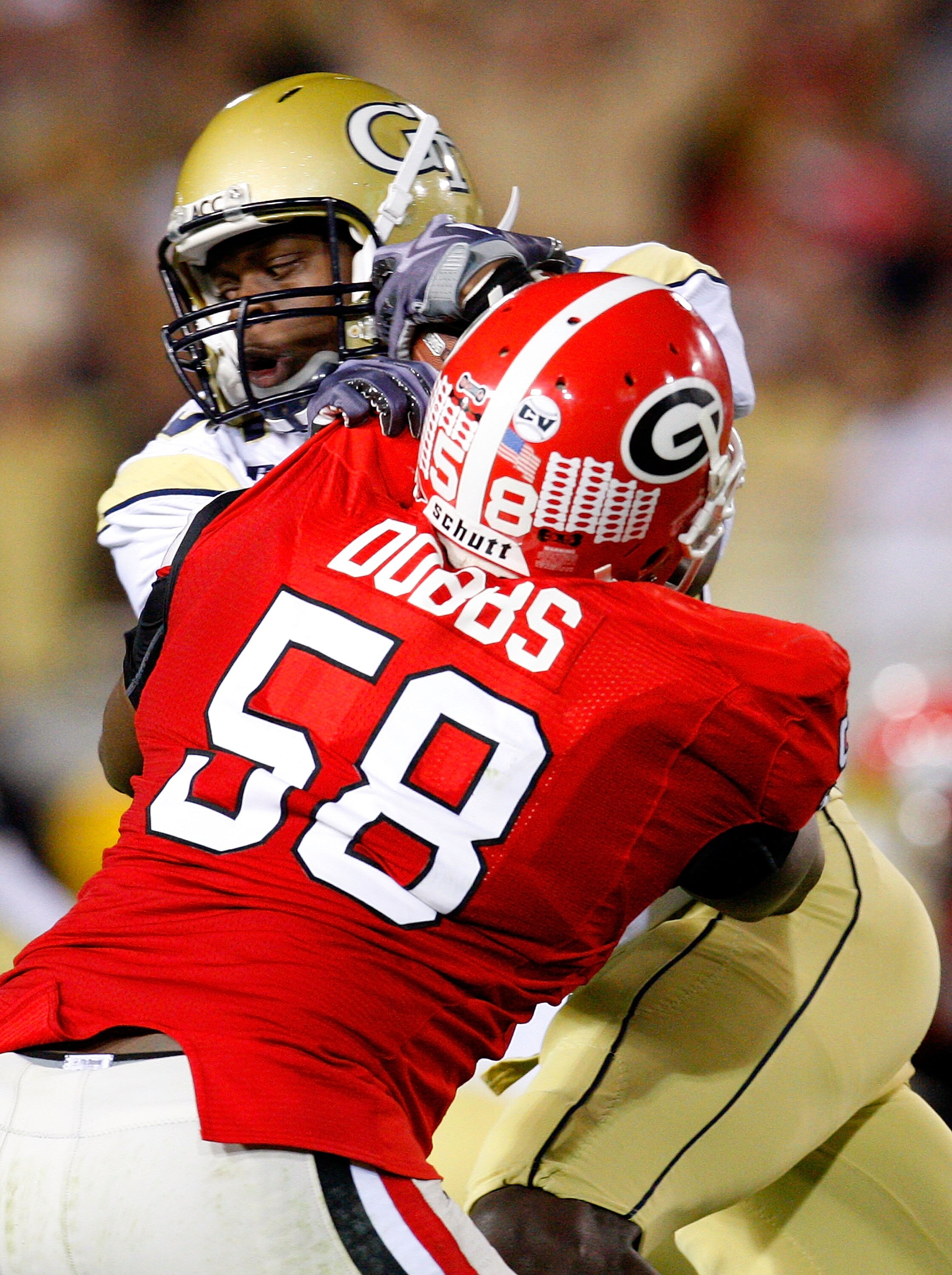 ATLANTA - NOVEMBER 28:  Stephen Hill #5 of the Georgia Tech Yellow Jackets is tackled by Demarcus Dobbs #58 of the Georgia Bulldogs at Bobby Dodd Stadium on November 28, 2009 in Atlanta, Georgia.  (Photo by Kevin C. Cox/Getty Images)