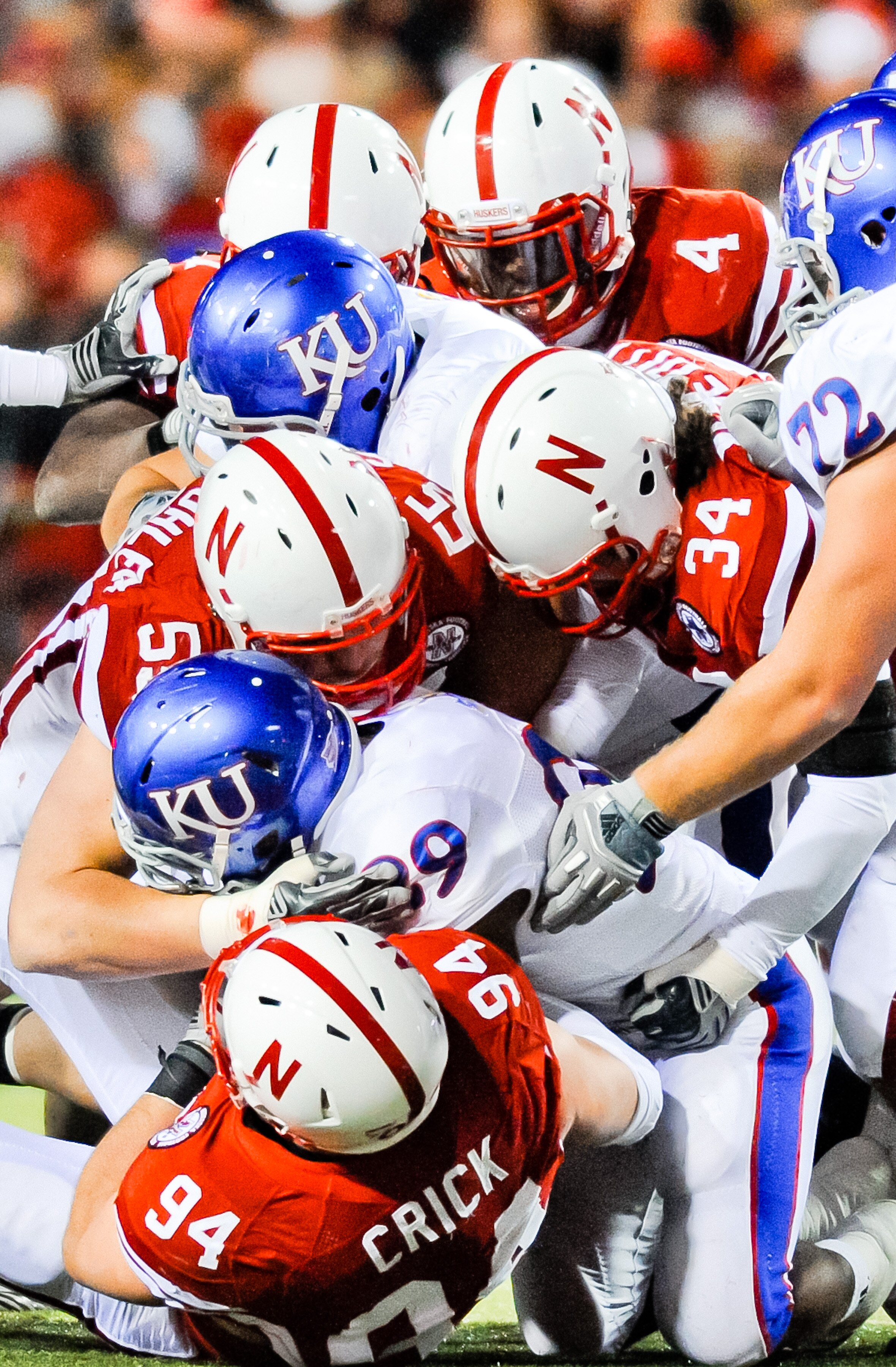 LINCOLN, NE - NOVEMBER 13: The Nebraska Cornhusker defense swarms James Sims #29 of the Kansas Jayhawks during their game at Memorial Stadium on November 13, 2010 in Lincoln, Nebraska. Nebraska Defeated Kansas 20-3. (Photo by Eric Francis/Getty Images)