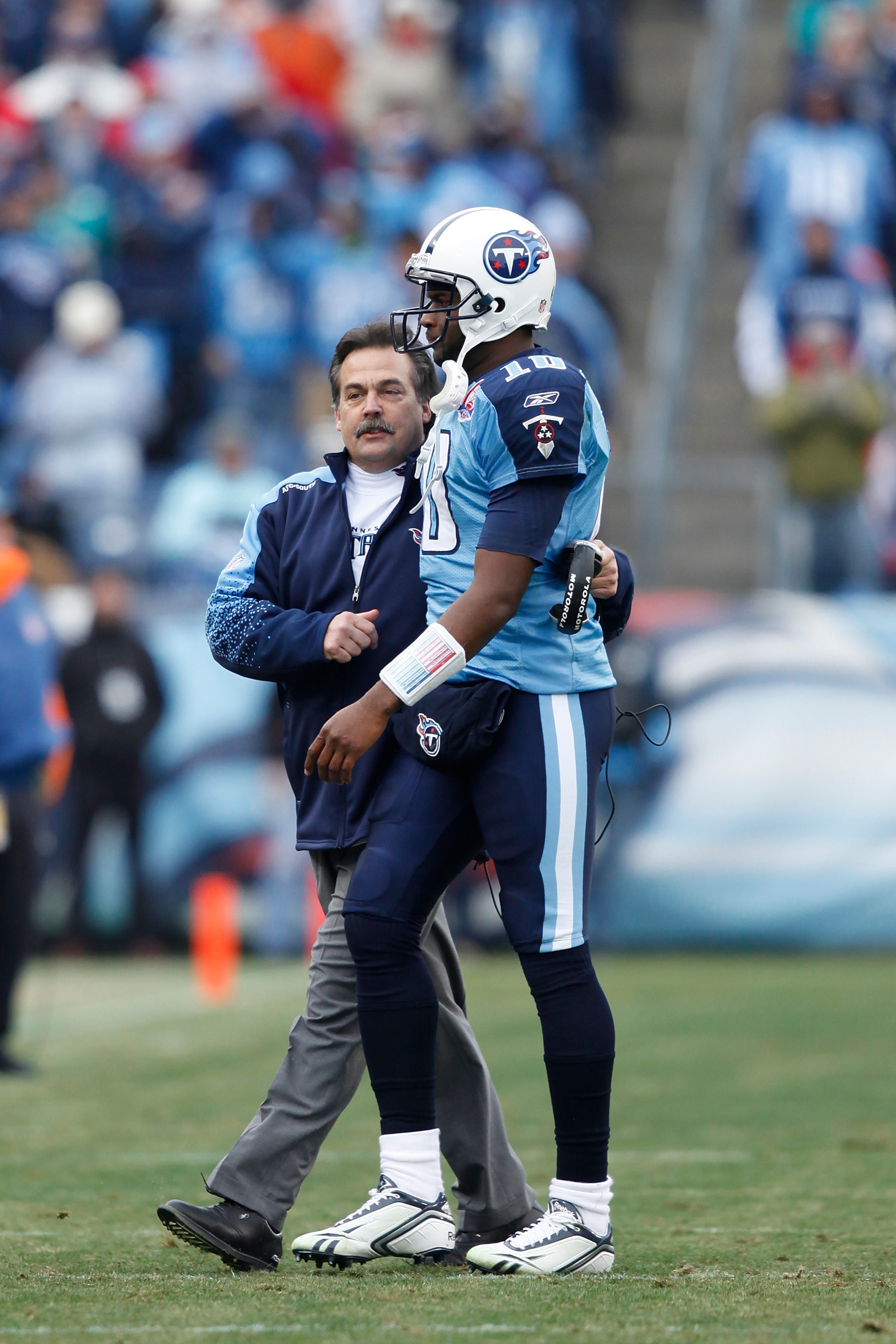 NASHVILLE, TN - DECEMBER 20: Head coach Jeff Fisher of the Tennessee Titans talks with Vince Young #10 after he threw a touchdown pass against the Miami Dolphins at LP Field on December 20, 2009 in Nashville, Tennessee. The Titans defeated the Dolphins 27