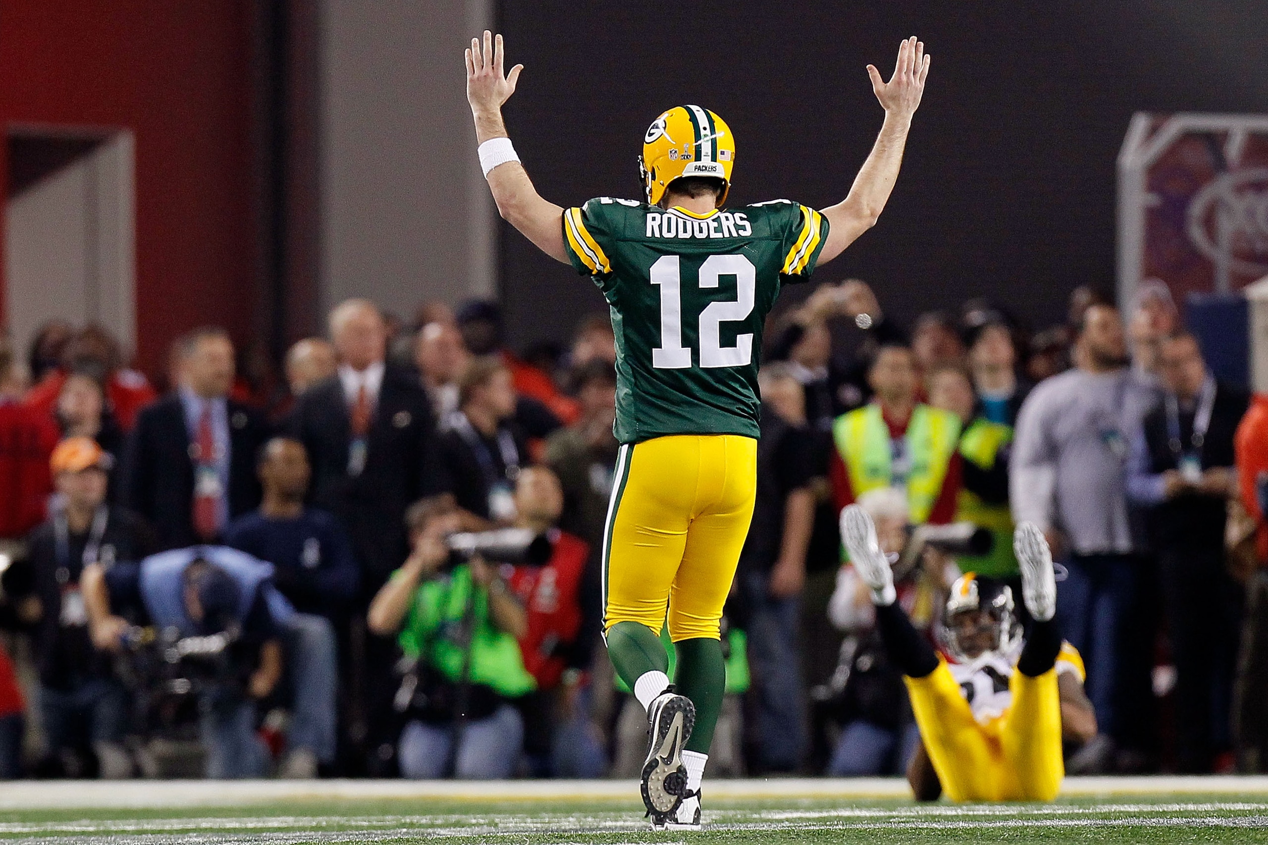 ARLINGTON, TX - FEBRUARY 06: Aaron Rodgers #12 of the Green Bay Packers celebrates after a touchdown pass to Greg Jennings against the Pittsburgh Steelers during Super Bowl XLV at Cowboys Stadium on February 6, 2011 in Arlington, Texas. (Photo by Kevin C ARLINGTON, TX - FEBRUARY 06: Aaron Rodgers #12 of the Green Bay Packers celebrates after a touchdown pass to Greg Jennings against the Pittsburgh Steelers during Super Bowl XLV at Cowboys Stadium on February 6, 2011 in Arlington, Texas. (Photo by Kevin C