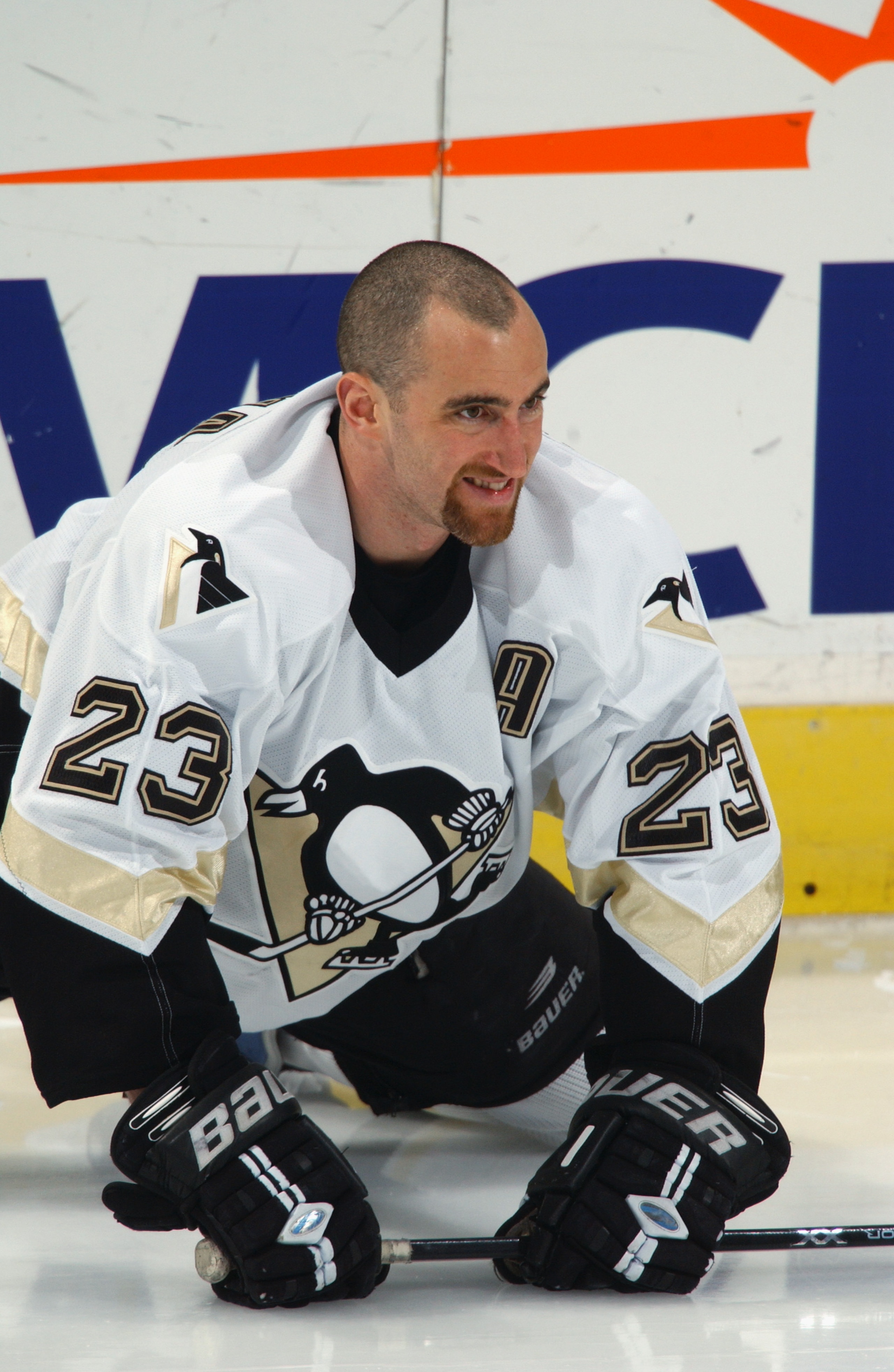 WASHINGTON D.C. - JANUARY 18:  Left wing Steve McKenna #23 of the Pittsburgh Pengiuns stretches before the game against the Washington Capitals on January 18, 2004 in Washington D.C. The Capitals won 4-3. (Photo by Mitchell Layton/Getty Images)
