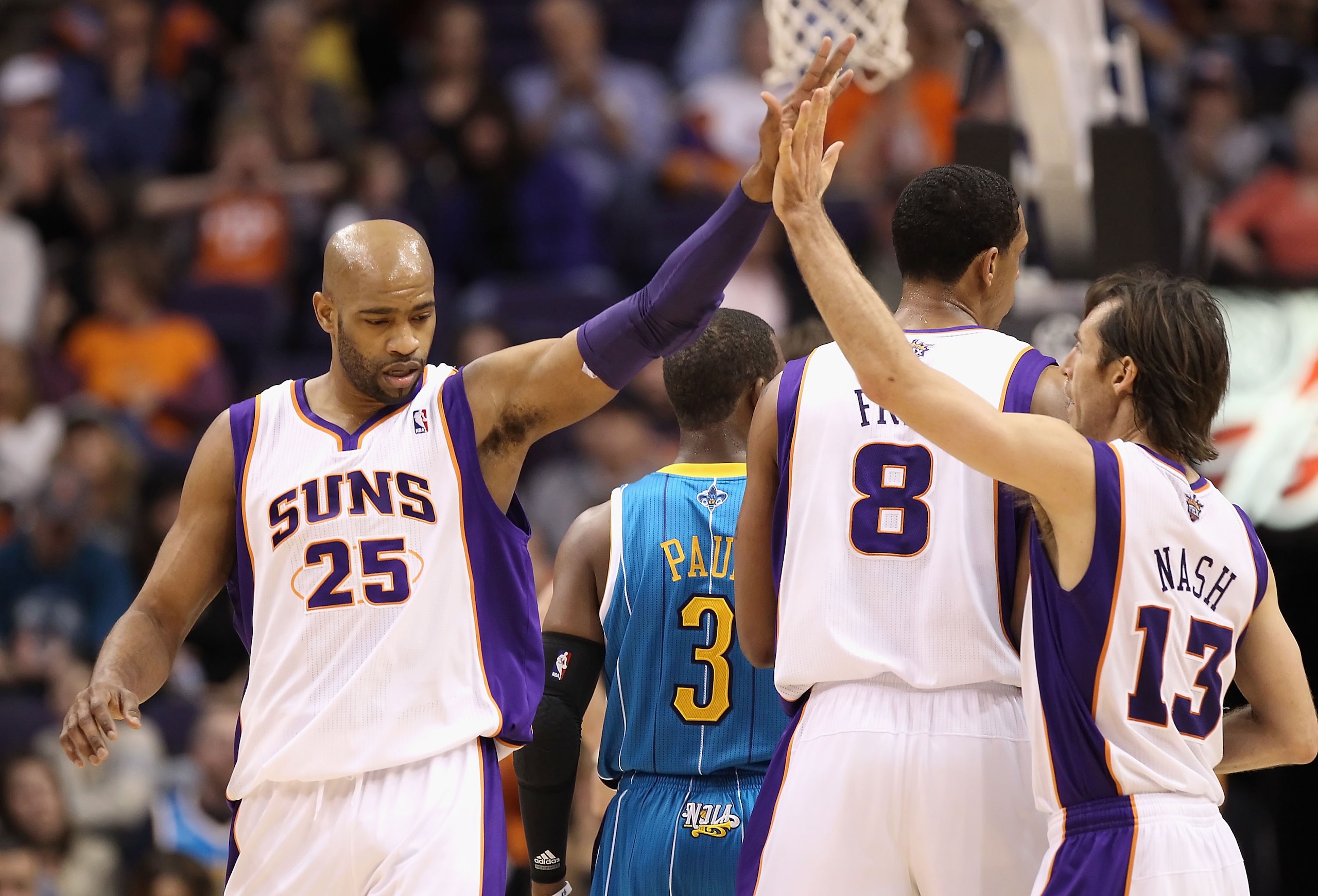 PHOENIX, AZ - JANUARY 30: Vince Carter #25 of the Phoenix Suns high fives teammate Steve Nash #13 after scoring against the New Orleans Hornets during the NBA game at US Airways Center on January 30, 2011 in Phoenix, Arizona. The Suns defeated the Horne PHOENIX, AZ - JANUARY 30: Vince Carter #25 of the Phoenix Suns high fives teammate Steve Nash #13 after scoring against the New Orleans Hornets during the NBA game at US Airways Center on January 30, 2011 in Phoenix, Arizona. The Suns defeated the Horne