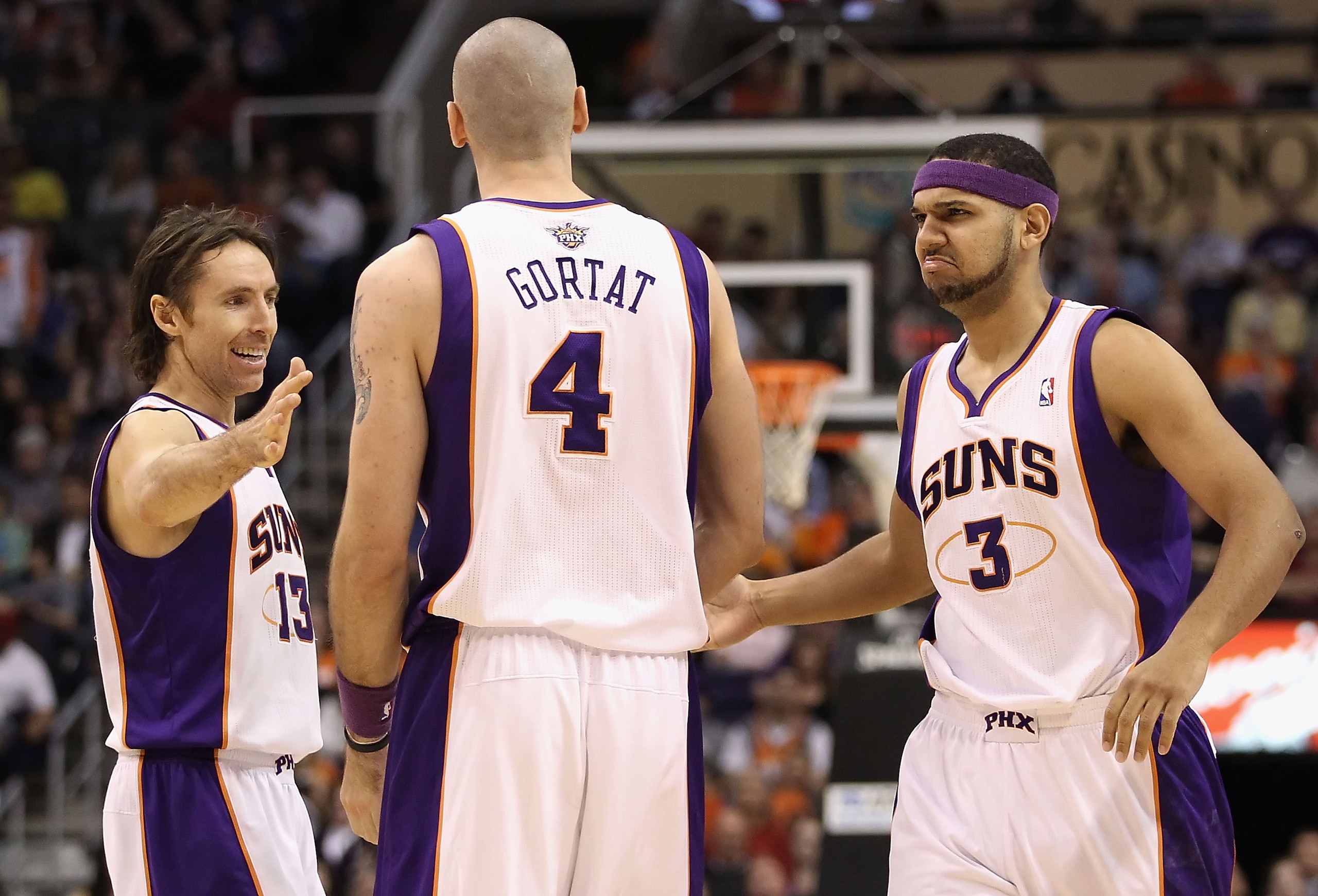 PHOENIX, AZ - JANUARY 30: (L-R) Steve Nash #13, Marcin Gortat #4 and Jared Dudley #3 of the Phoenix Suns celebrate after scoring against the New Orleans Hornets during the NBA game at US Airways Center on January 30, 2011 in Phoenix, Arizona. The Suns d PHOENIX, AZ - JANUARY 30: (L-R) Steve Nash #13, Marcin Gortat #4 and Jared Dudley #3 of the Phoenix Suns celebrate after scoring against the New Orleans Hornets during the NBA game at US Airways Center on January 30, 2011 in Phoenix, Arizona. The Suns d