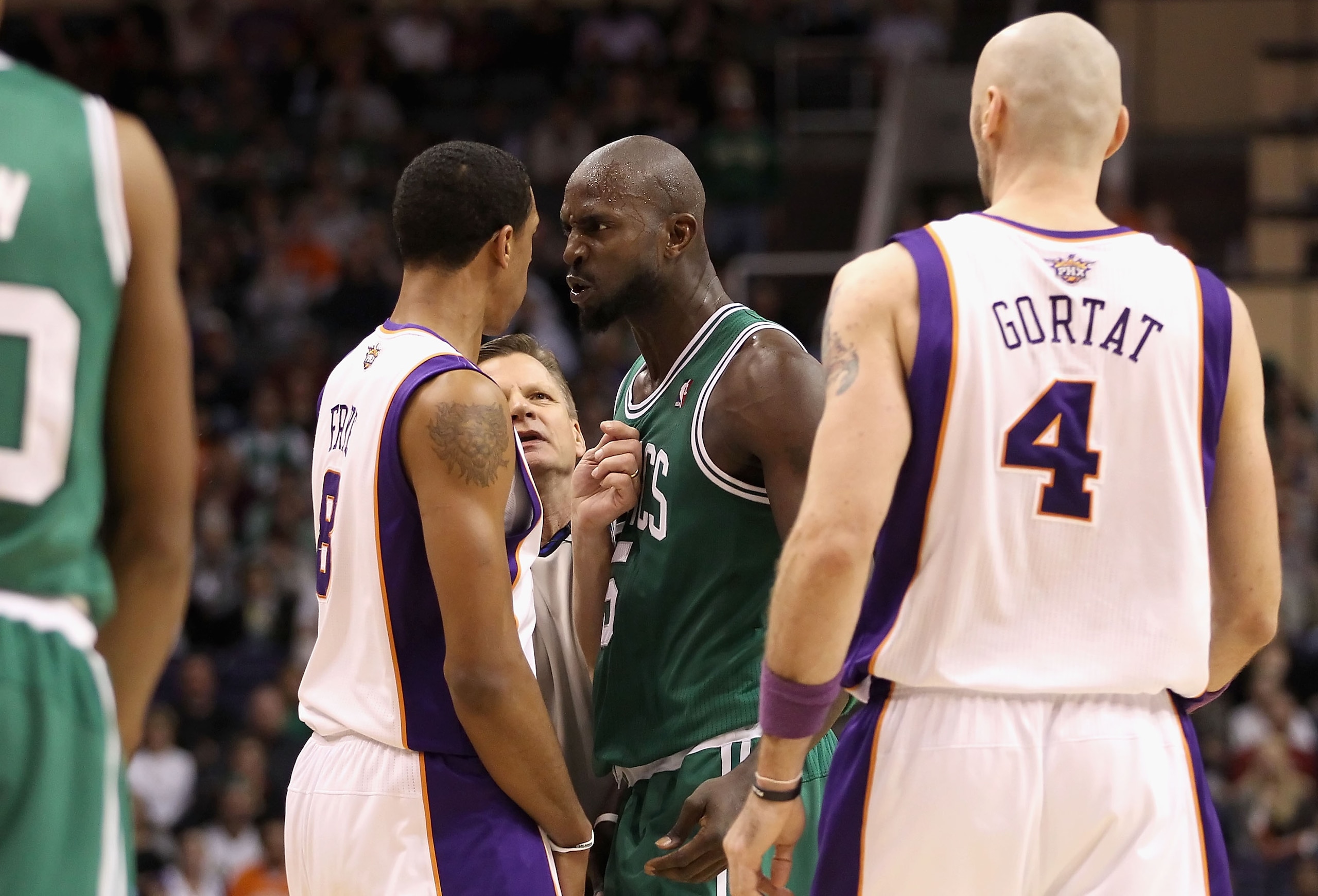 PHOENIX, AZ - JANUARY 28: Kevin Garnett #5 of the Boston Celtics stares down Channing Frye #8 of the Phoenix Suns after Garnett was called for a technical foul during the NBA game at US Airways Center on January 28, 2011 in Phoenix, Arizona. The Suns de PHOENIX, AZ - JANUARY 28: Kevin Garnett #5 of the Boston Celtics stares down Channing Frye #8 of the Phoenix Suns after Garnett was called for a technical foul during the NBA game at US Airways Center on January 28, 2011 in Phoenix, Arizona. The Suns de