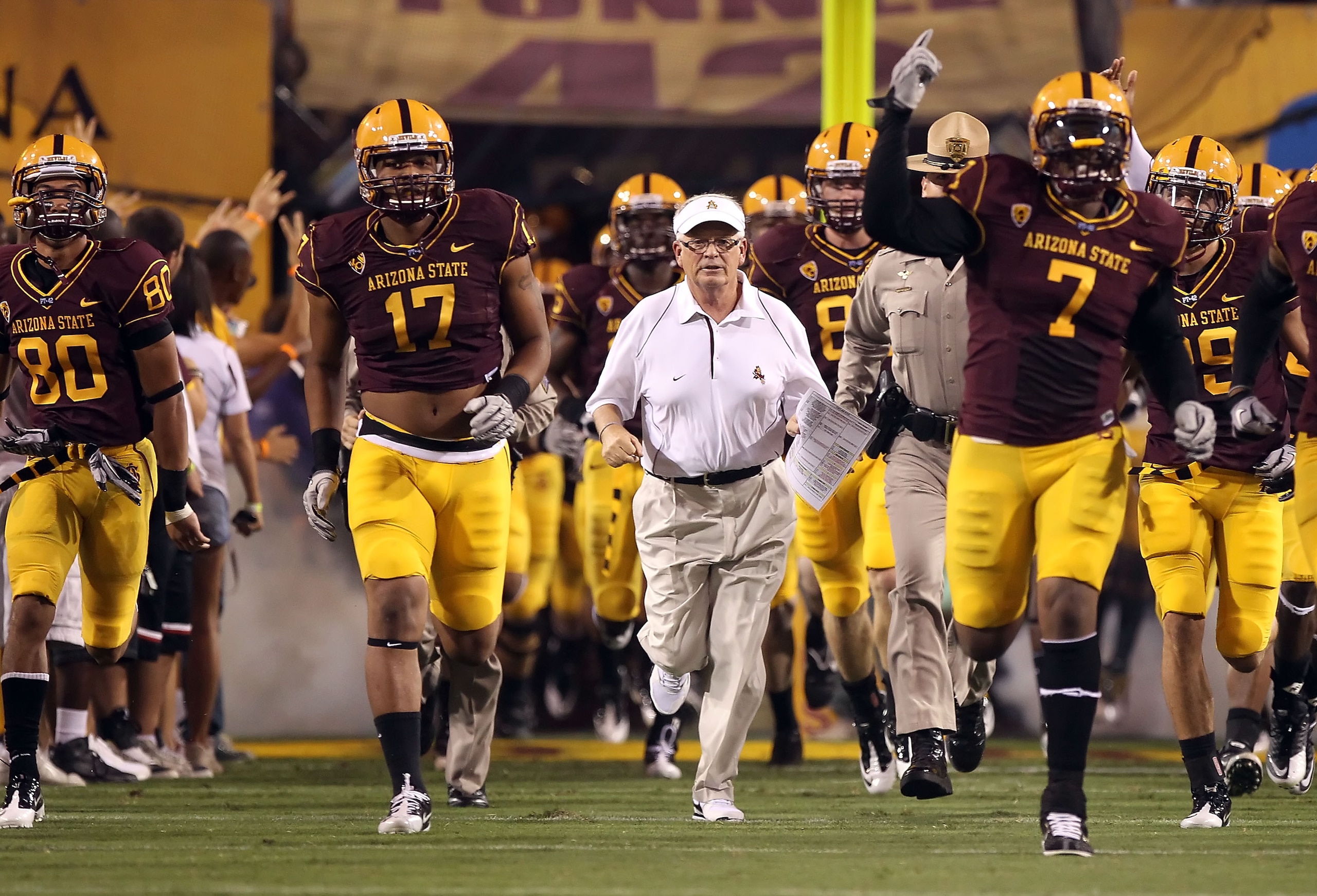 TEMPE, AZ - SEPTEMBER 04: Head coach Dennis Erickson of the Arizona State Sun Devils runs onto the field before the college football game against the Portland State Vikings at Sun Devil Stadium on September 4, 2010 in Tempe, Arizona. The Sun Devils defe TEMPE, AZ - SEPTEMBER 04: Head coach Dennis Erickson of the Arizona State Sun Devils runs onto the field before the college football game against the Portland State Vikings at Sun Devil Stadium on September 4, 2010 in Tempe, Arizona. The Sun Devils defe