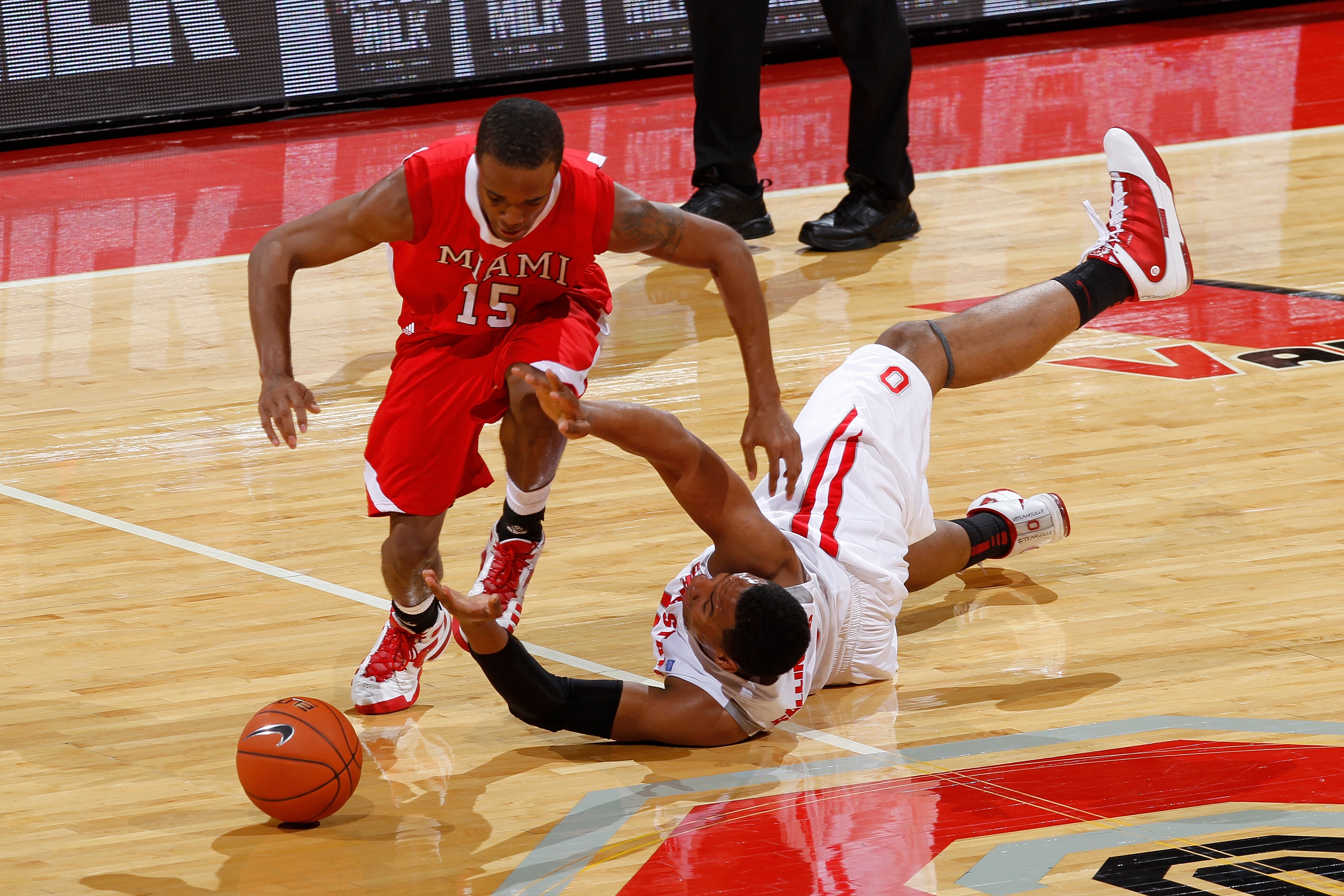 COLUMBUS, OH - NOVEMBER 26: Jared Sullinger #0 of the Ohio State Buckeyes knocks the ball away from Orlando Williams #15 of the Miami RedHawks at Value City Arena on November 26, 2010 in Columbus, Ohio. Ohio State won 66-45. (Photo by Joe Robbins/Getty Im
