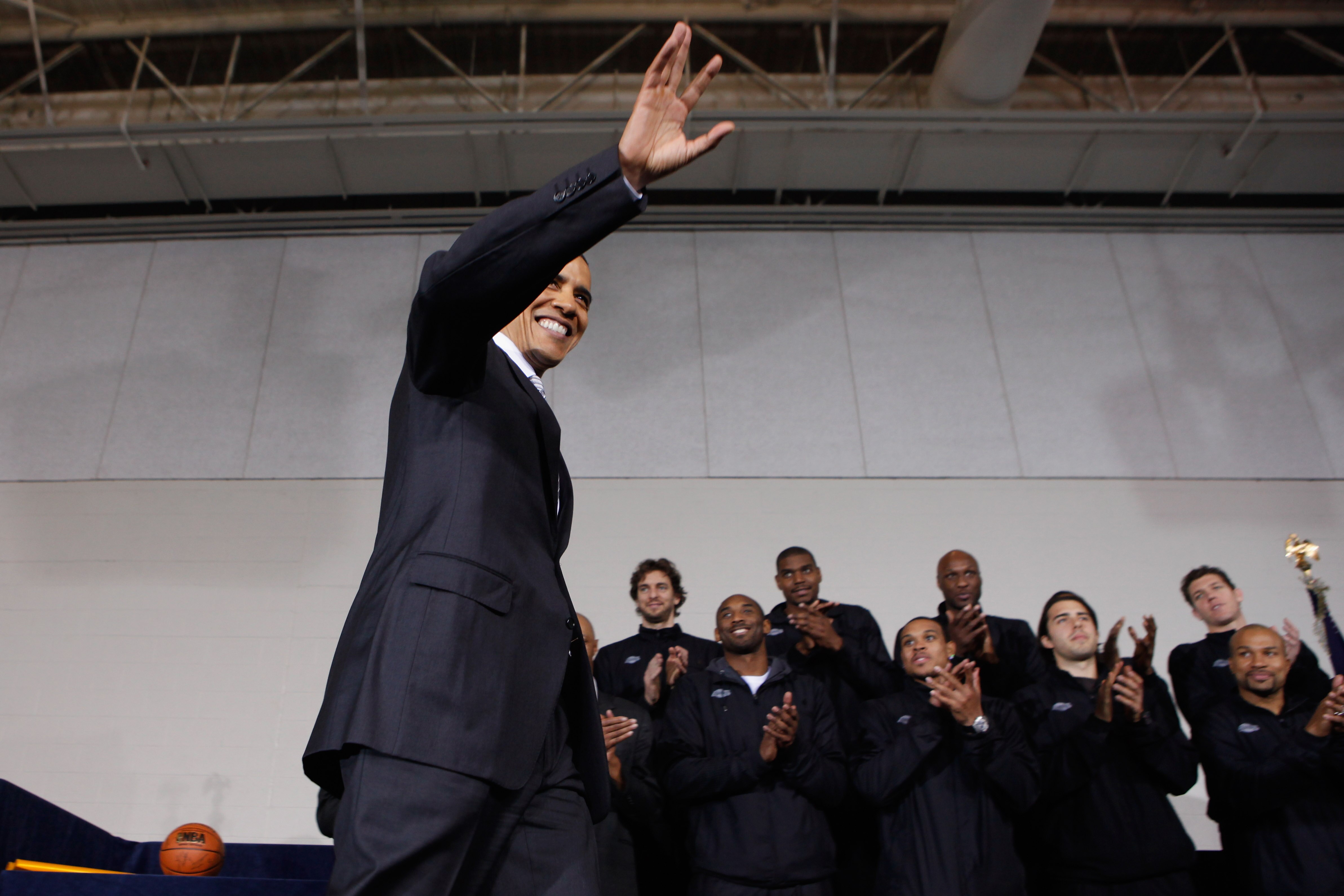WASHINGTON, DC - DECEMBER 13:  (AFP OUT) U.S. President Barack Obama (C) takes the stage with members of the 2010 NBA Championship Los Angeles Lakers during an event at the Boys and Girls Club at THEARC   December 13, 2010 in Washington, DC. The Lakers te