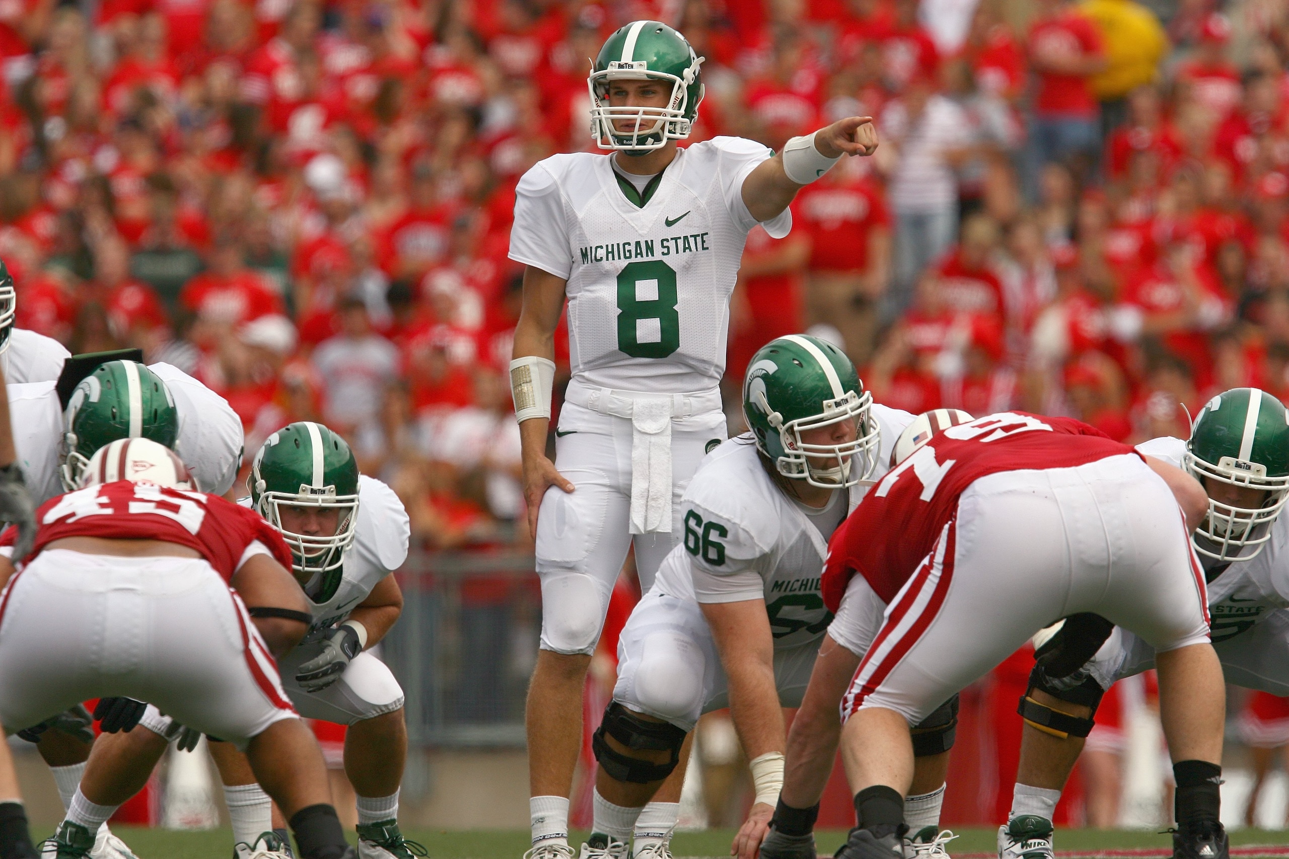 MADISON, WI - SEPTEMBER 26: Kirk Cousins #8 of the Michigan State Spartans motions on the line against the Wisconsin Badgers on September 26, 2009 at Camp Randall Stadium in Madison, Wisconsin. (Photo by Jonathan Daniel/Getty Images) MADISON, WI - SEPTEMBER 26: Kirk Cousins #8 of the Michigan State Spartans motions on the line against the Wisconsin Badgers on September 26, 2009 at Camp Randall Stadium in Madison, Wisconsin. (Photo by Jonathan Daniel/Getty Images)