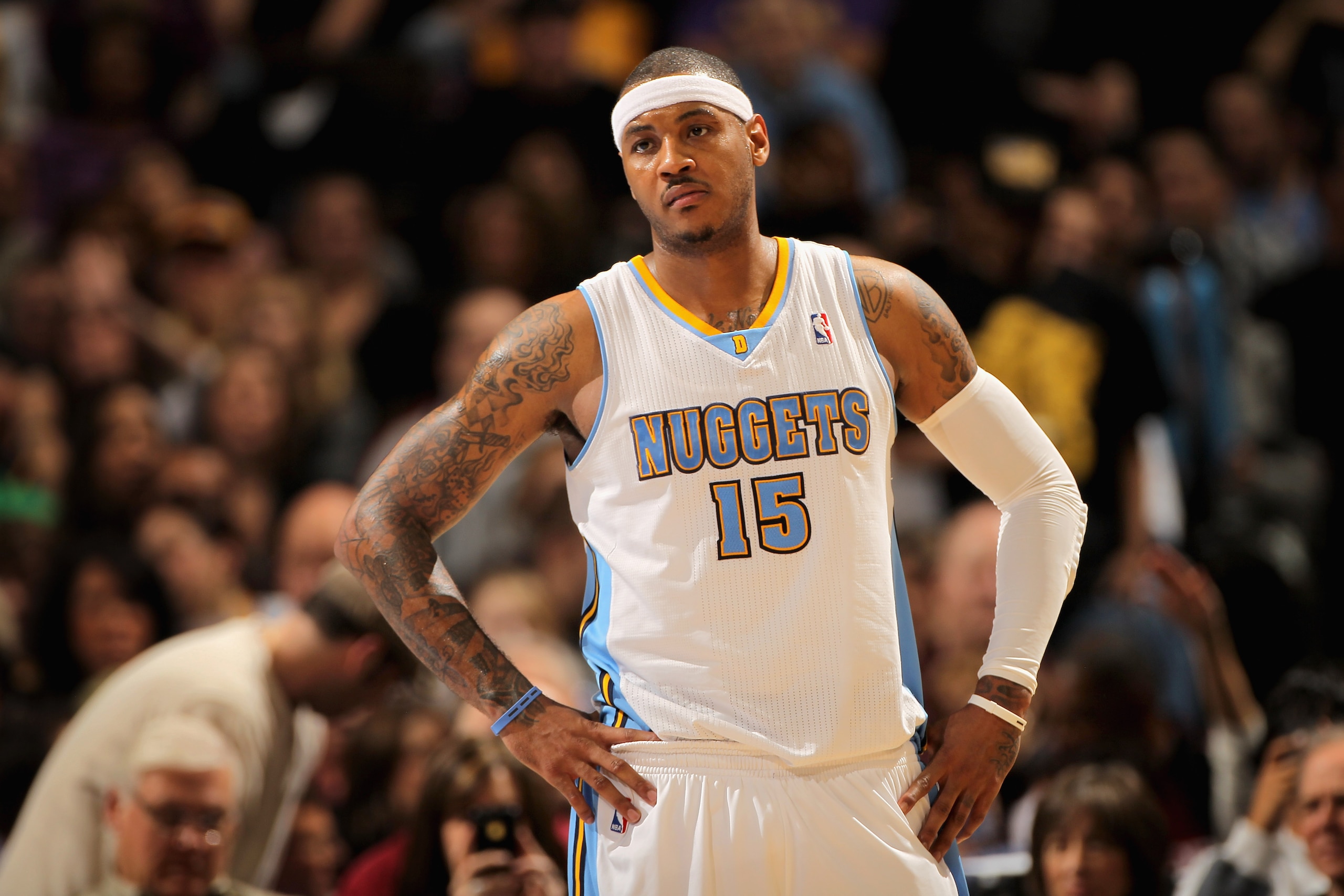 DENVER, CO - JANUARY 21: Carmelo Anthony #15 of the Denver Nuggets looks on during a break in the action against the Los Angeles Lakers at the Pepsi Center on January 21, 2011 in Denver, Colorado. The Lakers defeated the Nuggets 107-97. NOTE TO USER: Use DENVER, CO - JANUARY 21: Carmelo Anthony #15 of the Denver Nuggets looks on during a break in the action against the Los Angeles Lakers at the Pepsi Center on January 21, 2011 in Denver, Colorado. The Lakers defeated the Nuggets 107-97. NOTE TO USER: Use