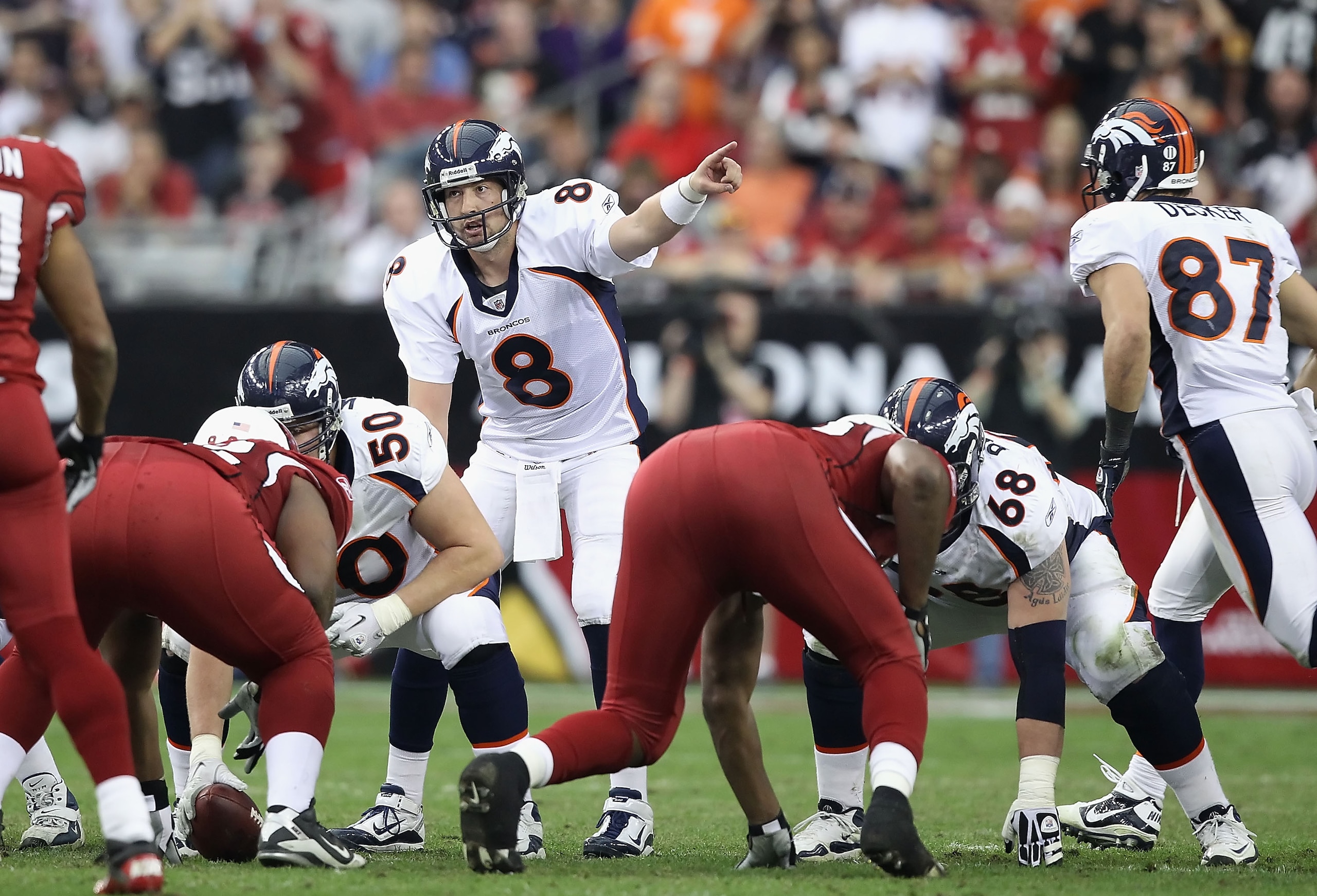 GLENDALE, AZ - DECEMBER 12: Quarterback Kyle Orton #8 of the Denver Broncos prepares to snap the ball during the NFL game against the Arizona Cardinals at the University of Phoenix Stadium on December 12, 2010 in Glendale, Arizona. The Cardinals defeate GLENDALE, AZ - DECEMBER 12: Quarterback Kyle Orton #8 of the Denver Broncos prepares to snap the ball during the NFL game against the Arizona Cardinals at the University of Phoenix Stadium on December 12, 2010 in Glendale, Arizona. The Cardinals defeate