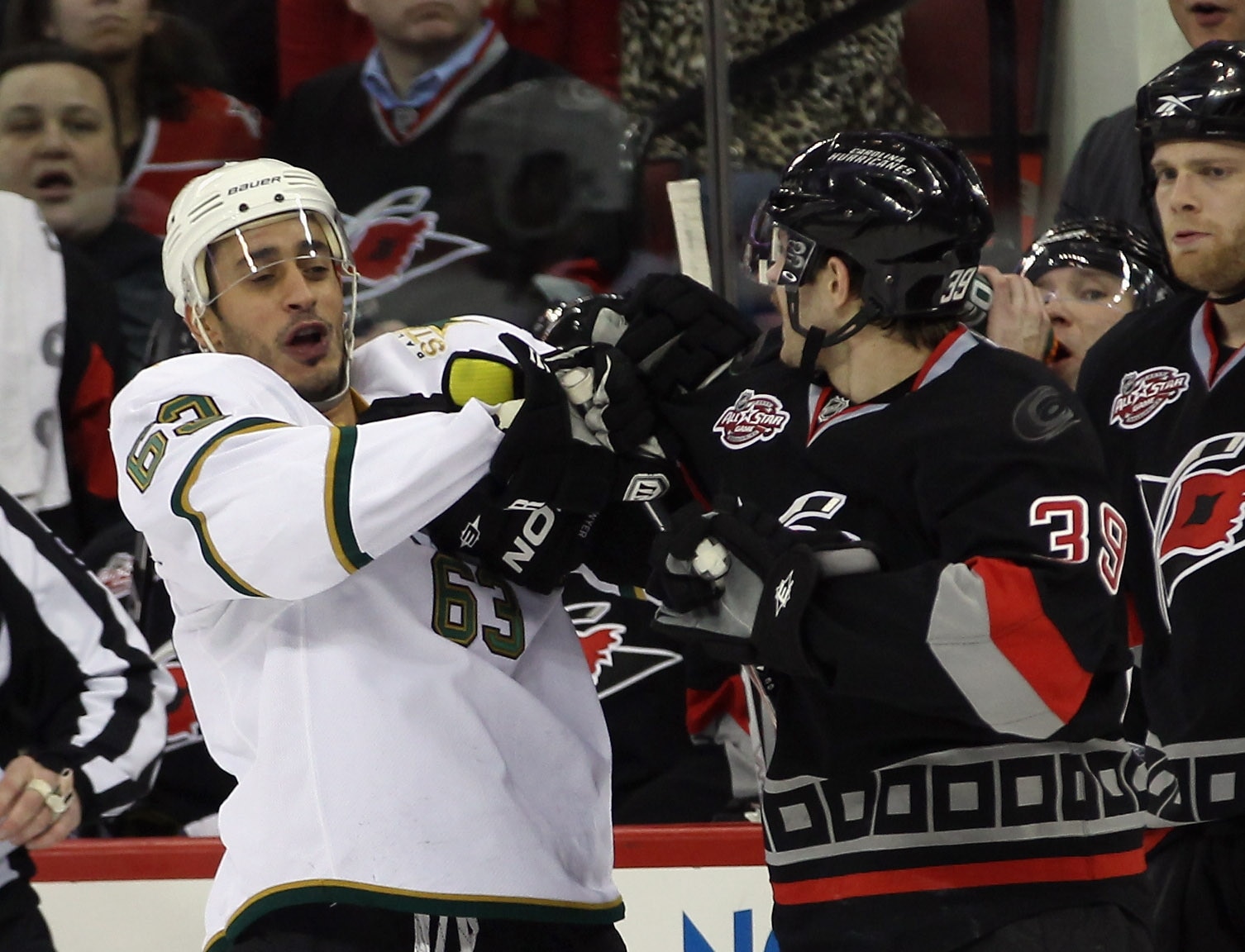 RALEIGH, NC - NOVEMBER 29: Mike Ribeiro #63 of the Dallas Stars and Patrick Dwyer #39 of the Carolina Hurricanes exchange pushes at the RBC Center on November 29, 2010 in Raleigh, North Carolina. The Stars defeated the Hurricanes 4-1. (Photo by Bruce Benn
