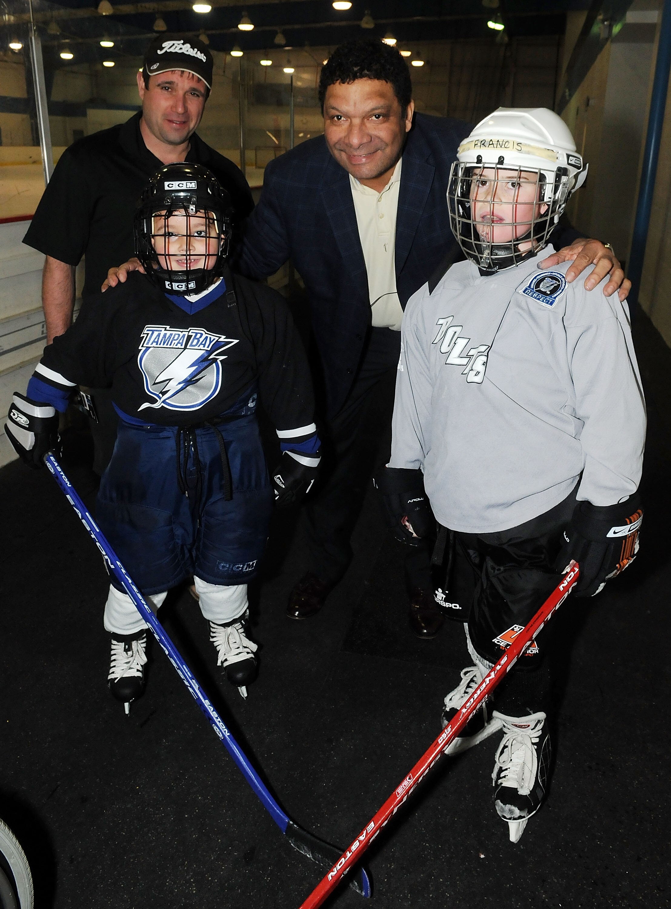 DAYTONA BEACH, FL - MARCH 06:  Tony McKegney (C) pose with kids during the Florida hockey day at the  Daytona Ice Arena on March 6, 2010 in Daytona Beach, Florida.  (Photo by Gerardo Mora/Getty Images for NHL)