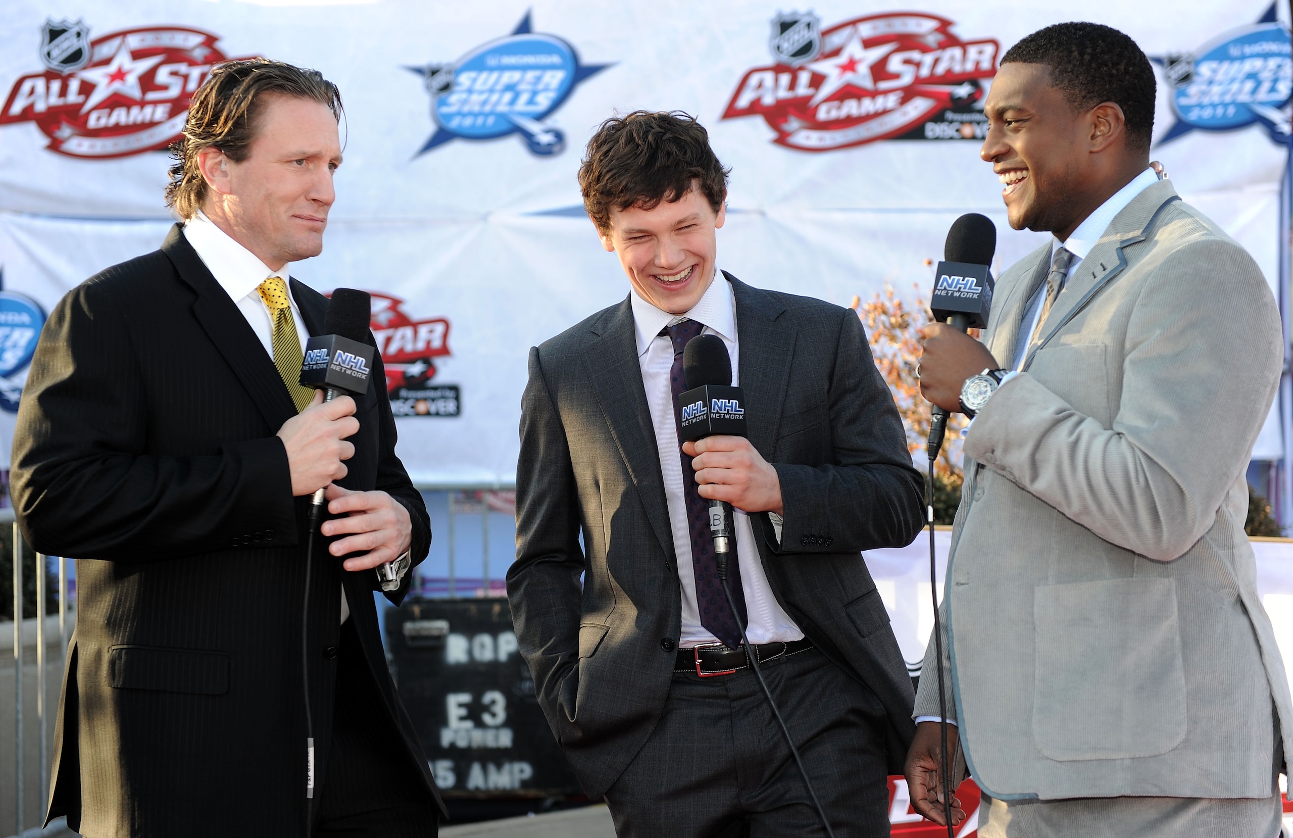 RALEIGH, NC - JANUARY 29:  Jeff Skinner (C) of the Carolina Hurricanes for Team Staal speaks to Kevin Weekes (R) and Jeremy Roenick as he arrives at the NHL All-Star red carpet part of 2011 NHL All-Star Weekend on January 29, 2011 in Raleigh, North Caroli