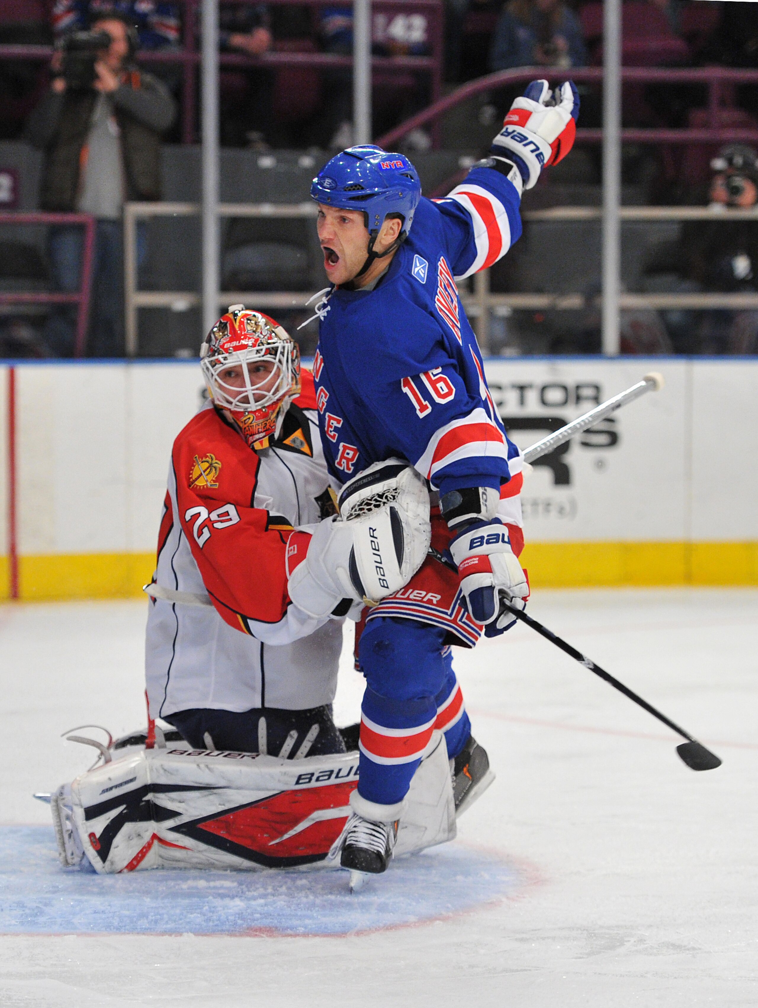 NEW YORK, NY - JANUARY 25: Sean Avery #16 of the New York Rangers collides with Tomas Vokoun #29 of the Florida Panthers during the second period at Madison Square Garden on January 25, 2011 in New York City. (Photo by Christopher Pasatieri/Getty Images) NEW YORK, NY - JANUARY 25: Sean Avery #16 of the New York Rangers collides with Tomas Vokoun #29 of the Florida Panthers during the second period at Madison Square Garden on January 25, 2011 in New York City. (Photo by Christopher Pasatieri/Getty Images)