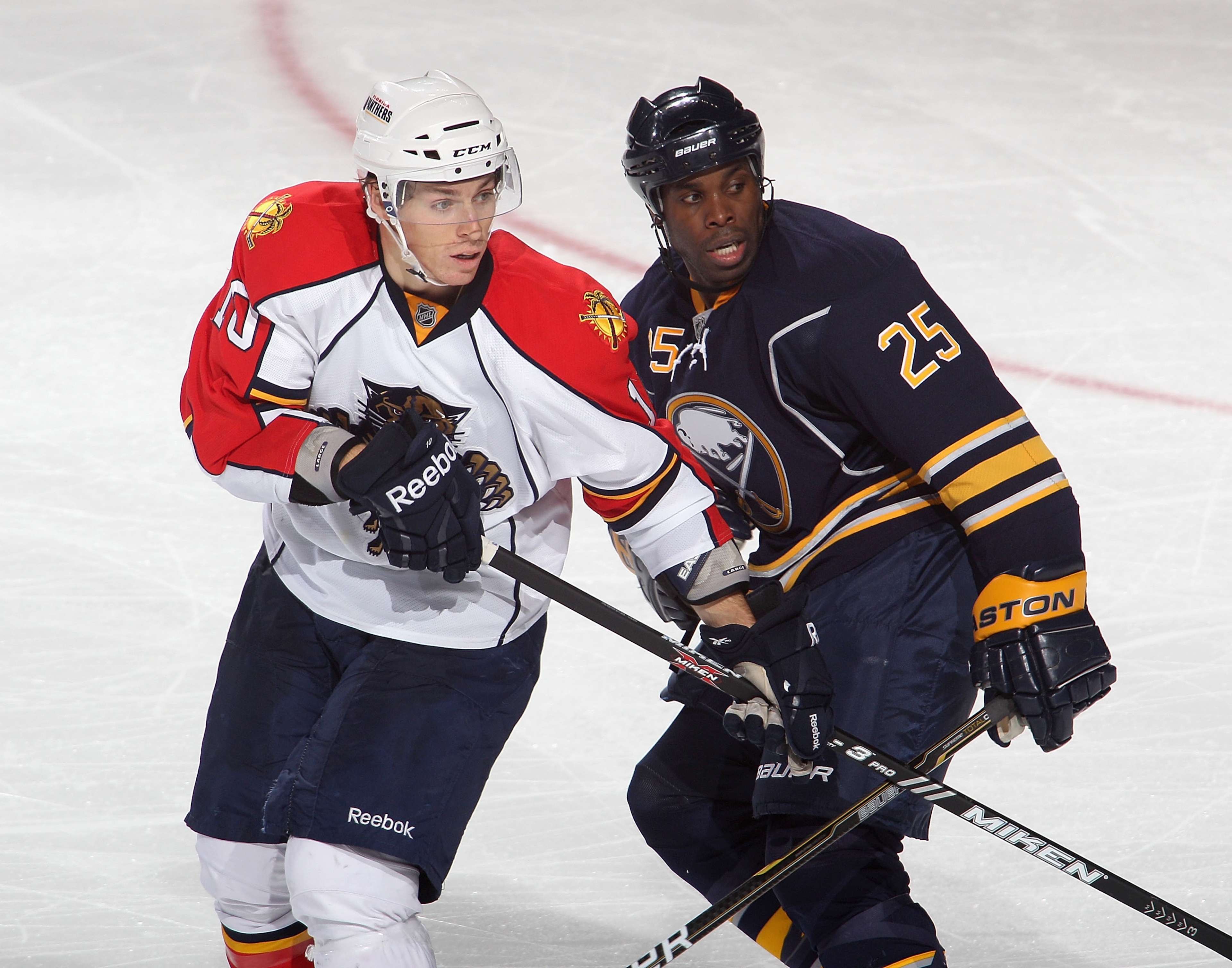 BUFFALO, NY - DECEMBER 23:  Mike Grier #25 of the Buffalo Sabres skates against  David Booth #10 of the Florida Panthers at HSBC Arena on December 23, 2010 in Buffalo, New York.  (Photo by Rick Stewart/Getty Images)