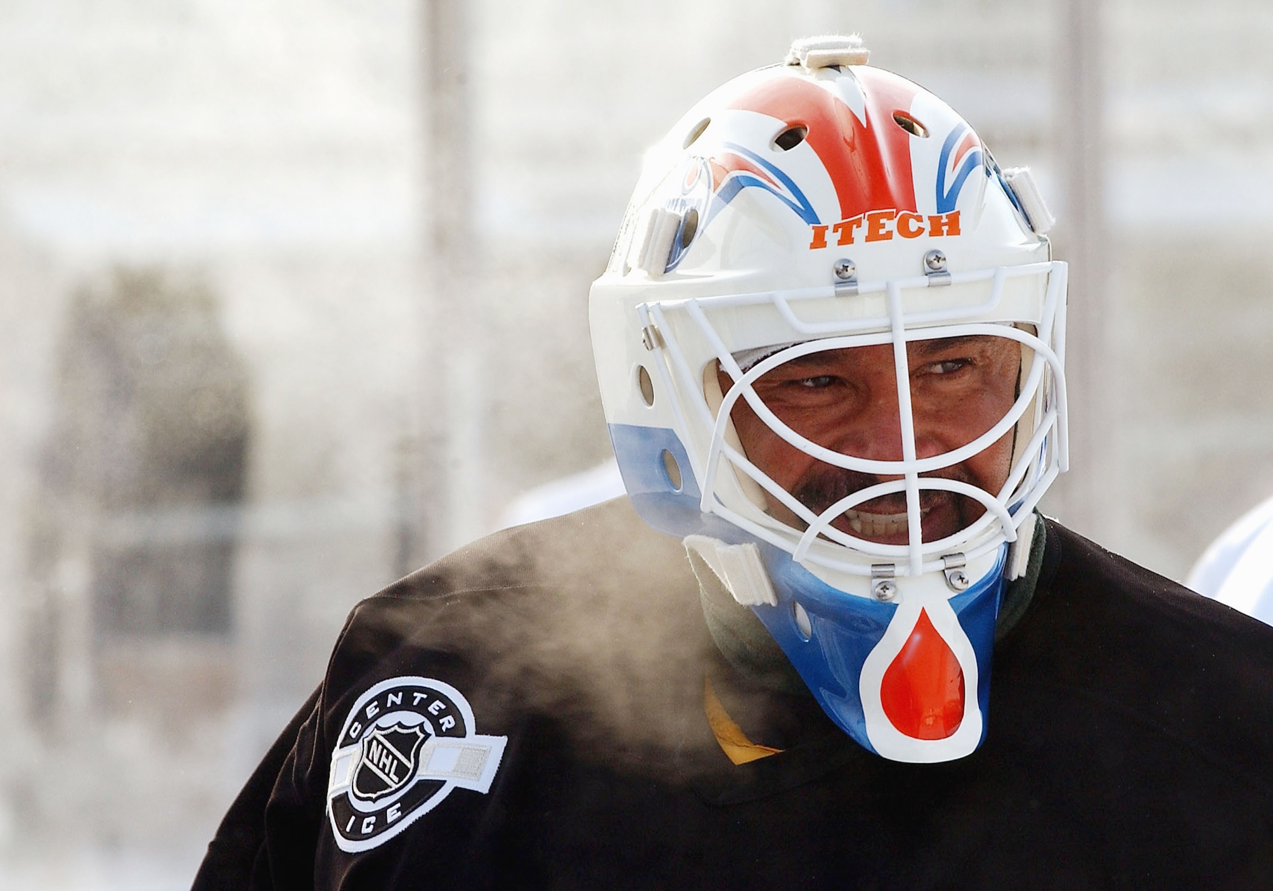 EDMONTON - NOVEMBER 21:  Grant Fuhr #31 of the Edmonton Oilers Alumni takes a moment to catch his breath at outdoor practice in very cold temperatures November 21, 2003 in Edmonton, Alberta. Practice is in preperation for the upcoming Heritage Classic hoc