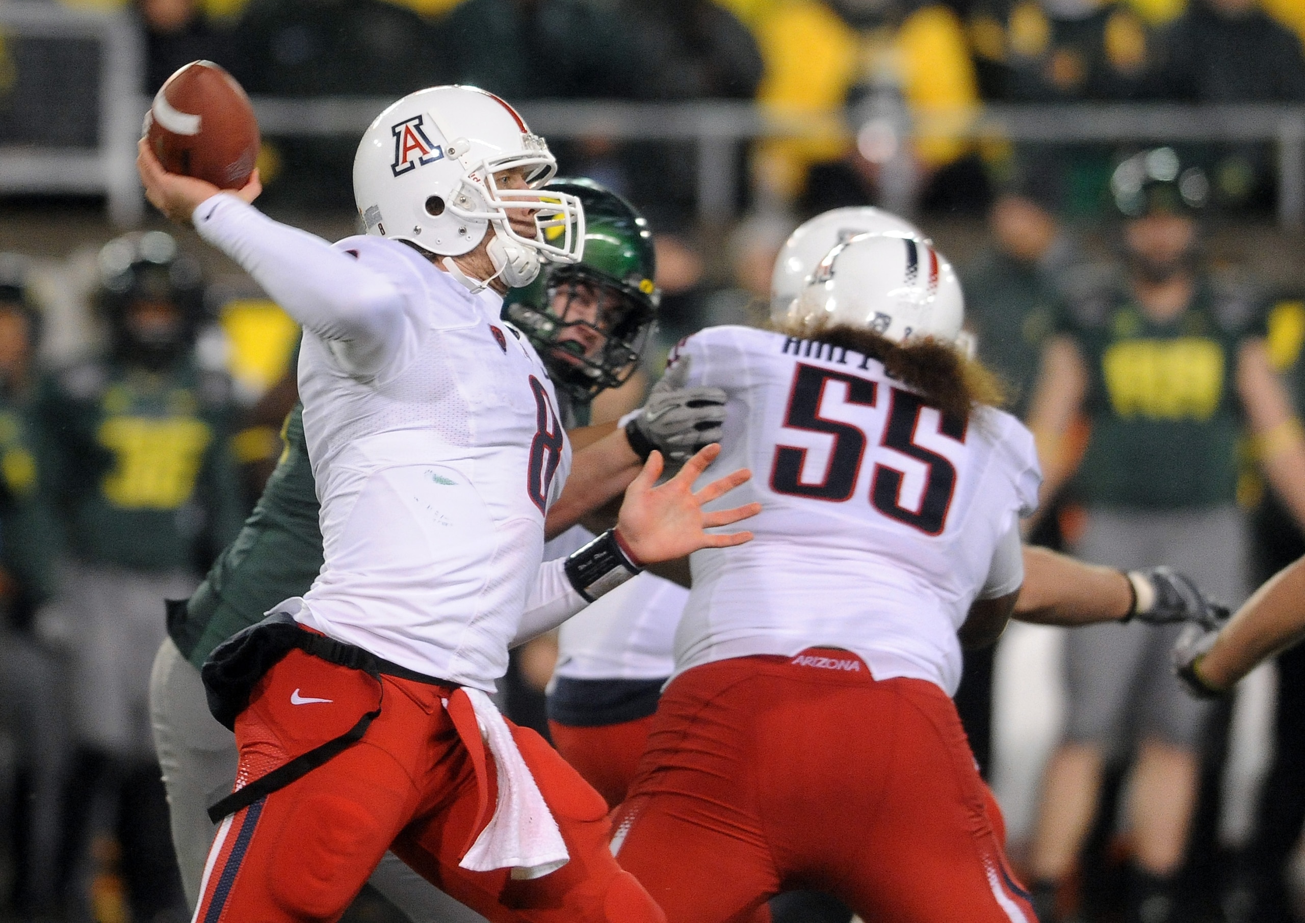 EUGENE, OR - NOVEMBER 26: Quarterback Nick Foles #8 of the Arizona Wildcats passes the ball in the fourth quarter of the game against the Oregon Ducks at Autzen Stadium on November 26, 2010 in Eugene, Oregon. The Ducks won the game 48-29.(Photo by Steve D EUGENE, OR - NOVEMBER 26: Quarterback Nick Foles #8 of the Arizona Wildcats passes the ball in the fourth quarter of the game against the Oregon Ducks at Autzen Stadium on November 26, 2010 in Eugene, Oregon. The Ducks won the game 48-29.(Photo by Steve D