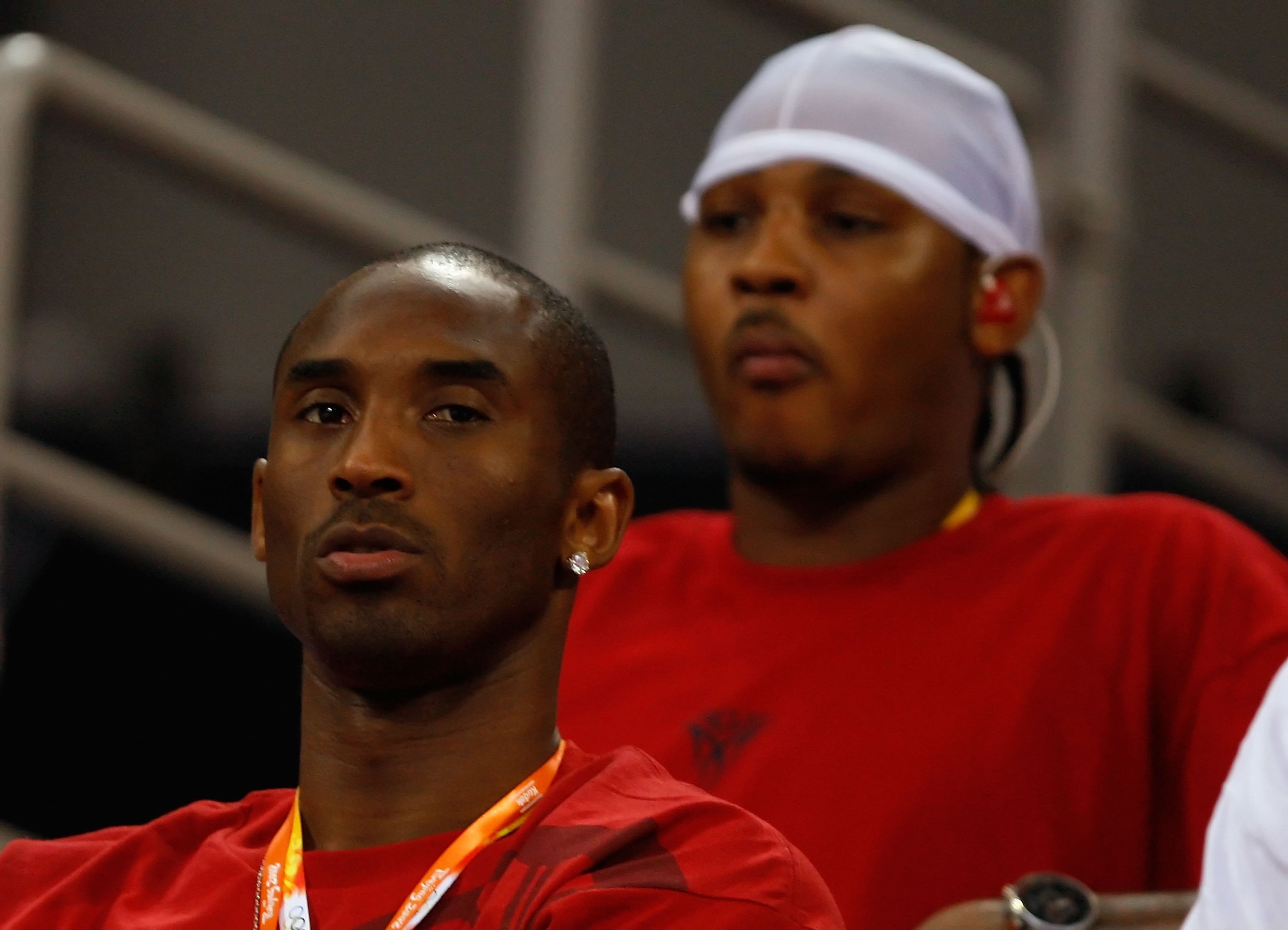BEIJING - AUGUST 11:  Kobe Bryant (L) and Carmelo Anthony of the United States men's basketball team watch the United Staes women play against China during their women's basketball preliminary game on Day 3 of the Beijing 2008 Olympic Games at the Wukeson
