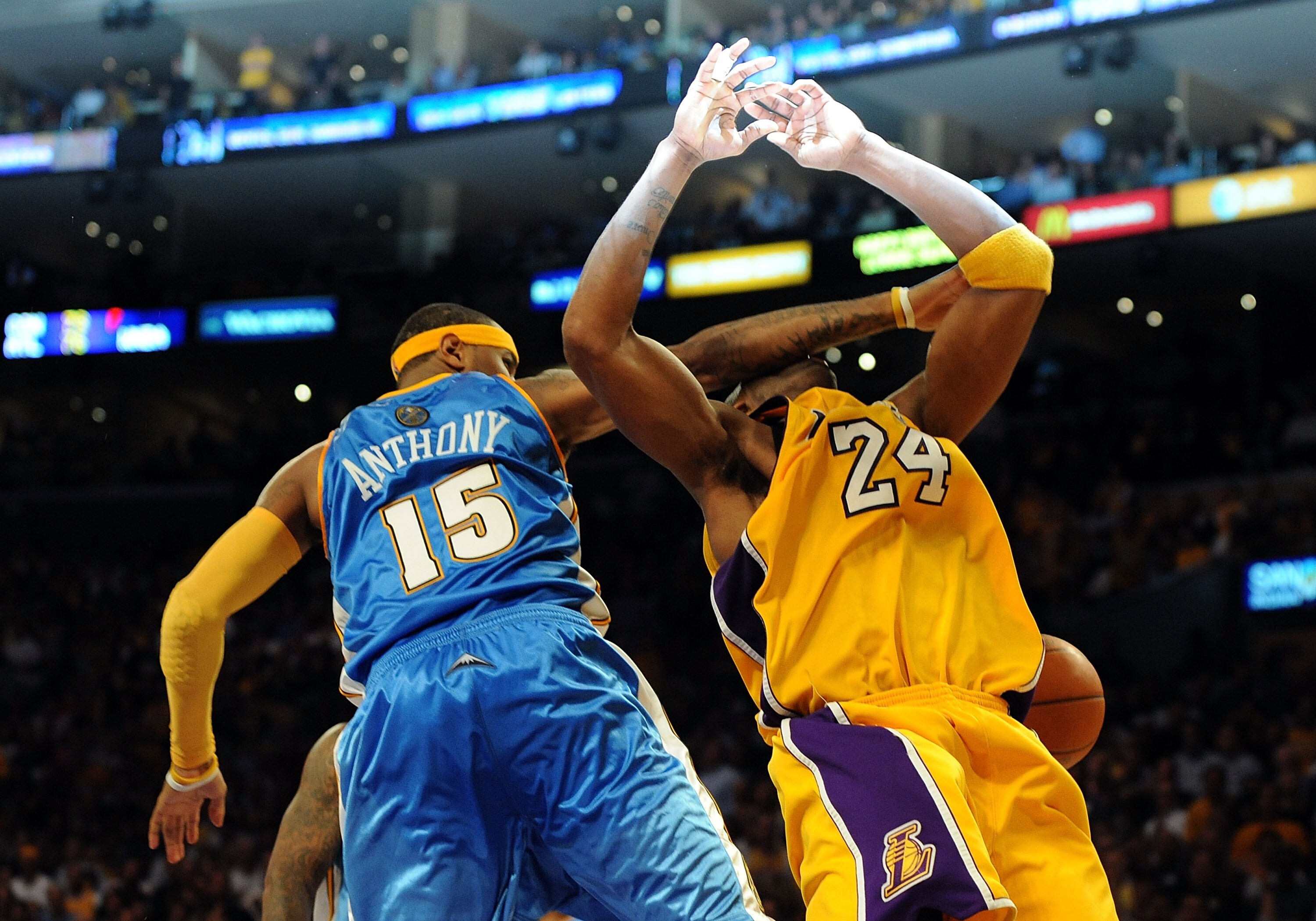 LOS ANGELES, CA - MAY 27:  Kobe Bryant #24 of the Los Angeles Lakers is fouled by Carmelo Anthony #15 of the Denver Nuggets in the fourth quarter of Game Five of the Western Conference Finals during the 2009 NBA Playoffs at Staples Center on May 27, 2009